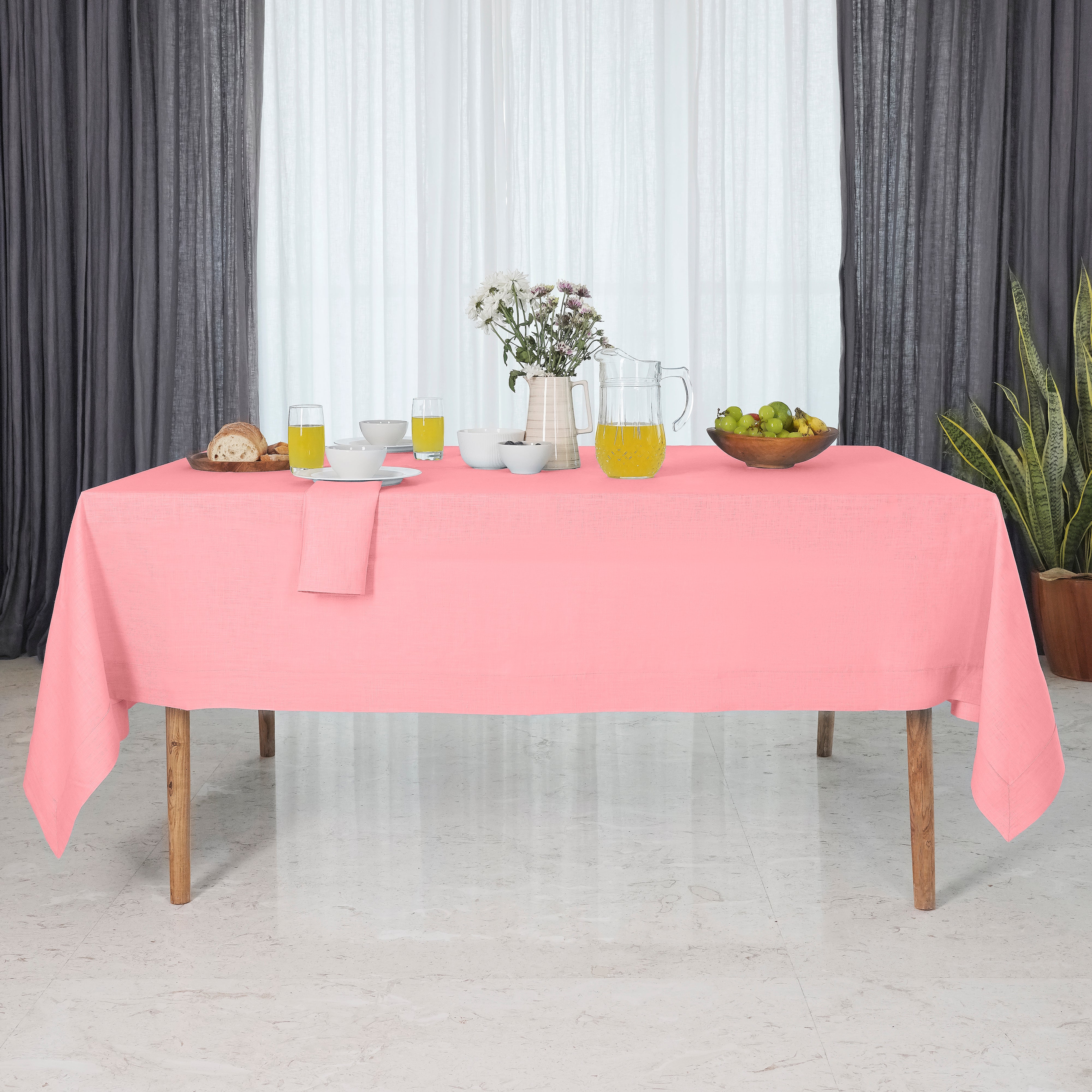 Close-up of the mitered corners on a dusty pink pure linen tablecloth