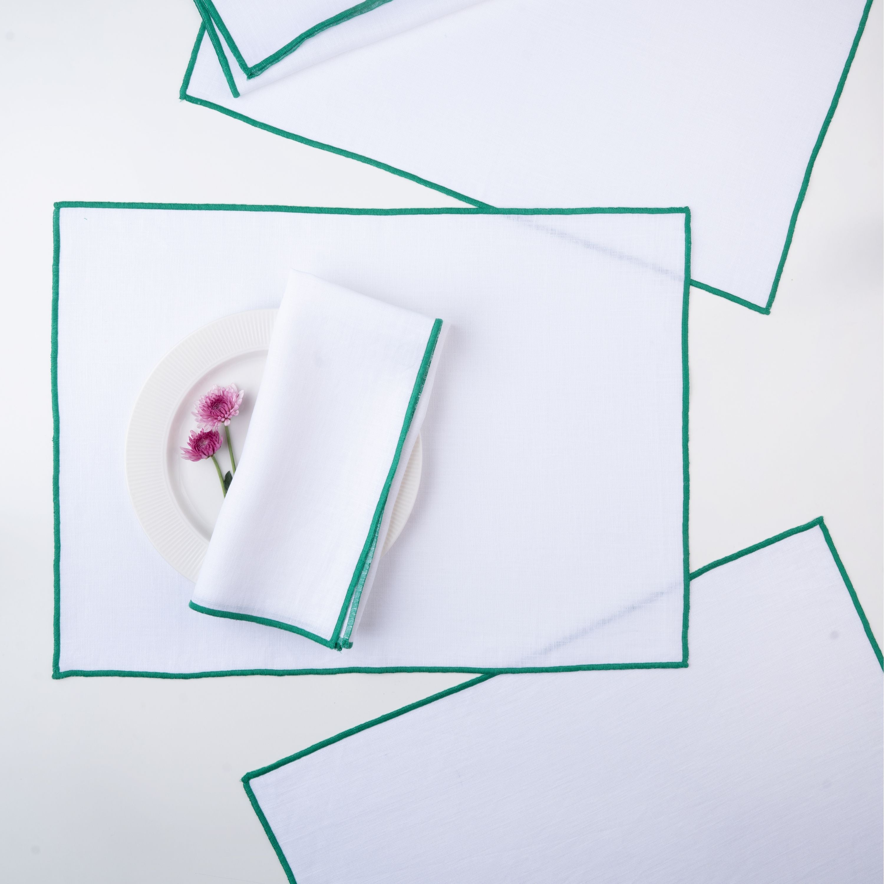 White and green pure linen placemats with matching D'Moksha table linens