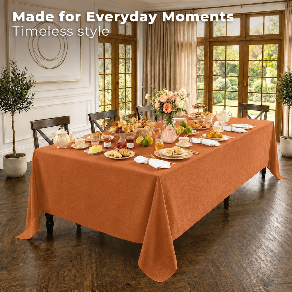 Close-up of the mitered corners on a rust pure linen tablecloth