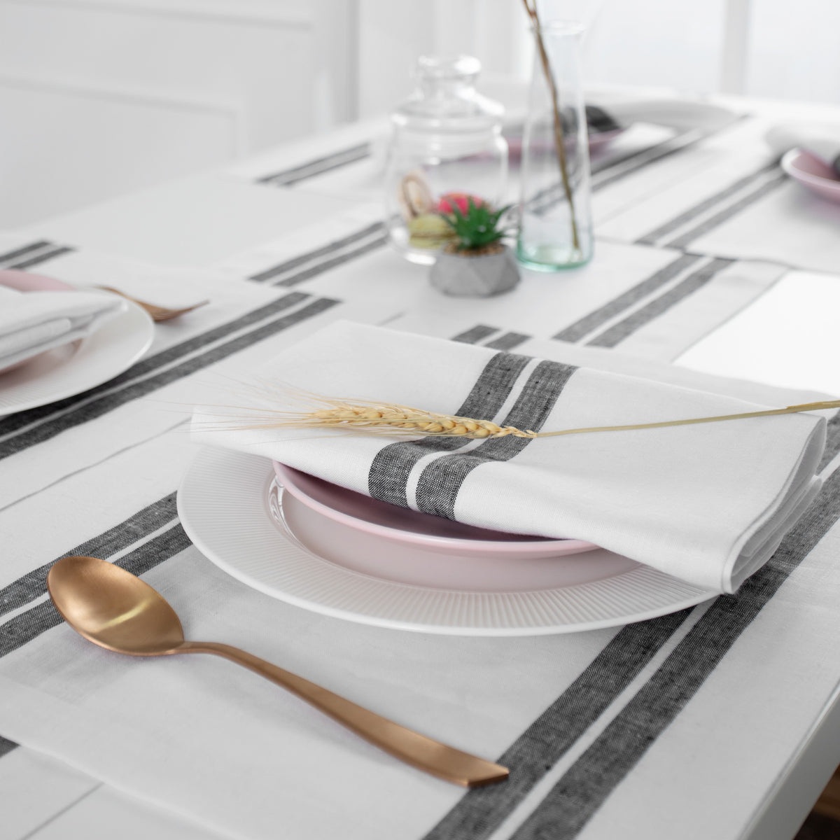 Close-up of the french stripe on a white and black pure linen table runner
