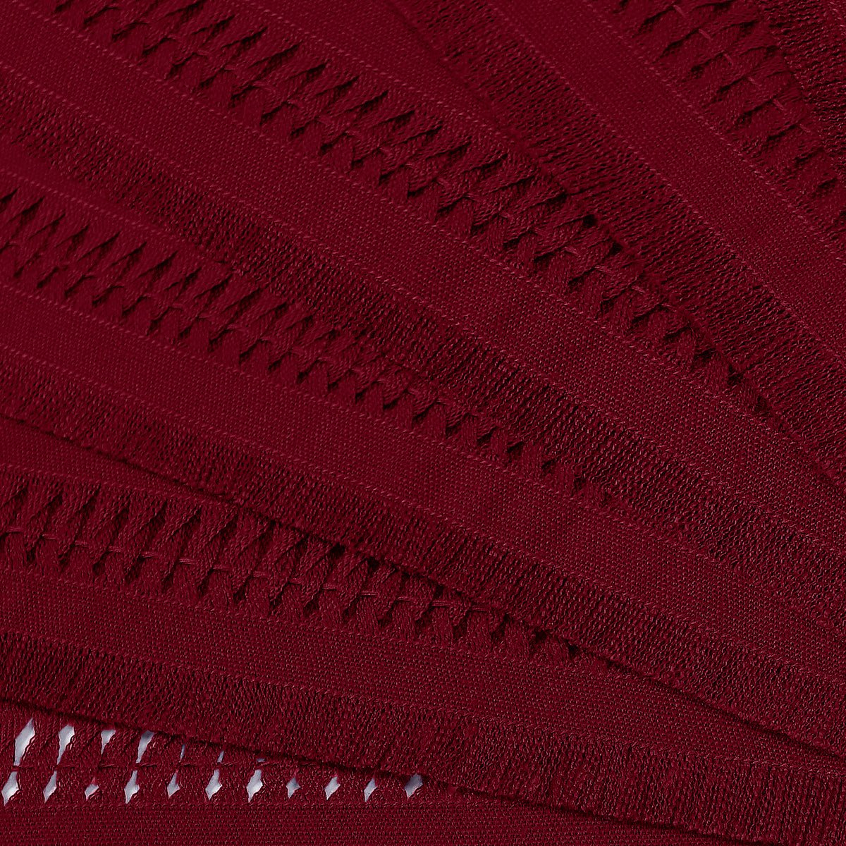 Close-up of the hand-hemstitch edge on red faux linen dinner napkins