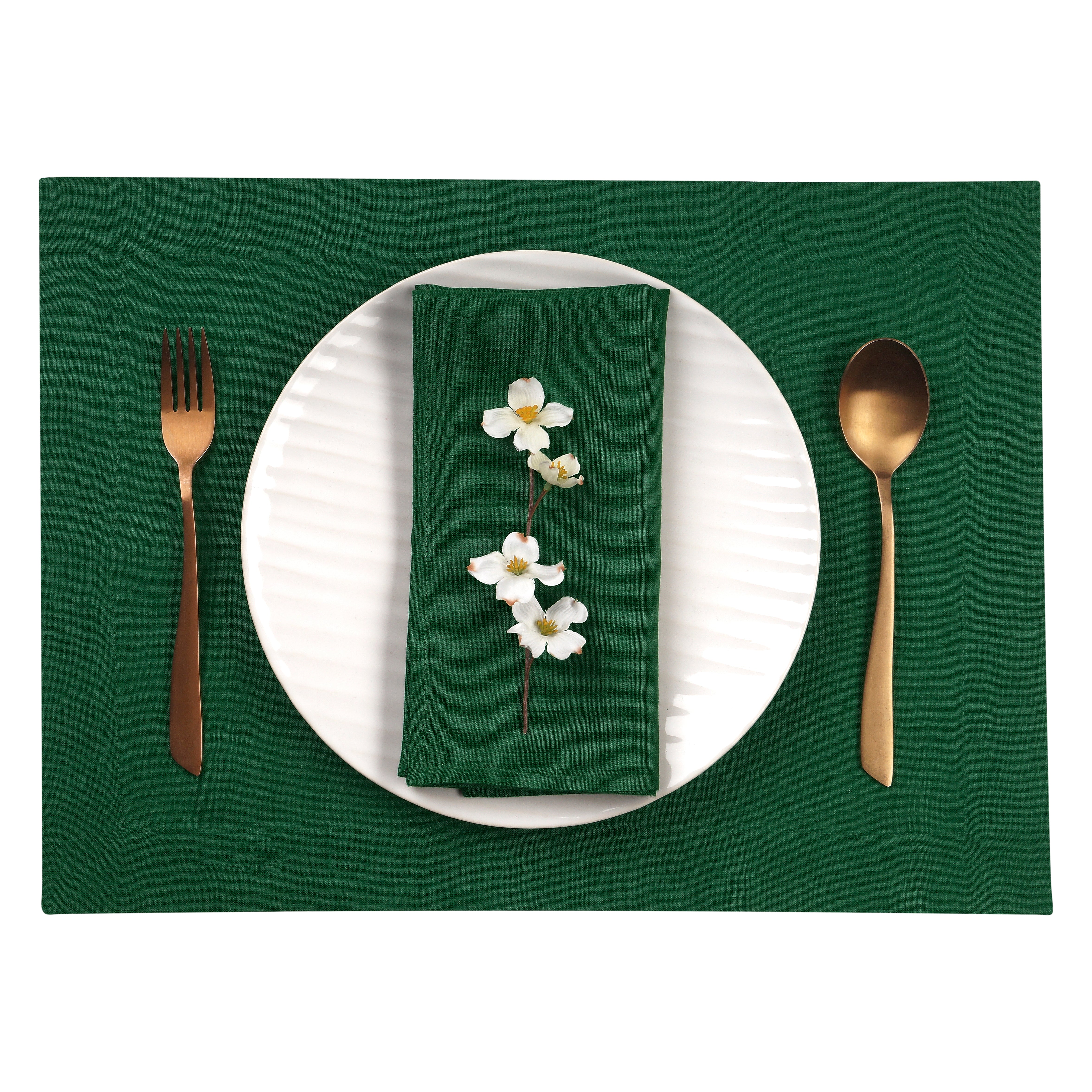 Close-up of the hemmed edge on forest green linen placemats