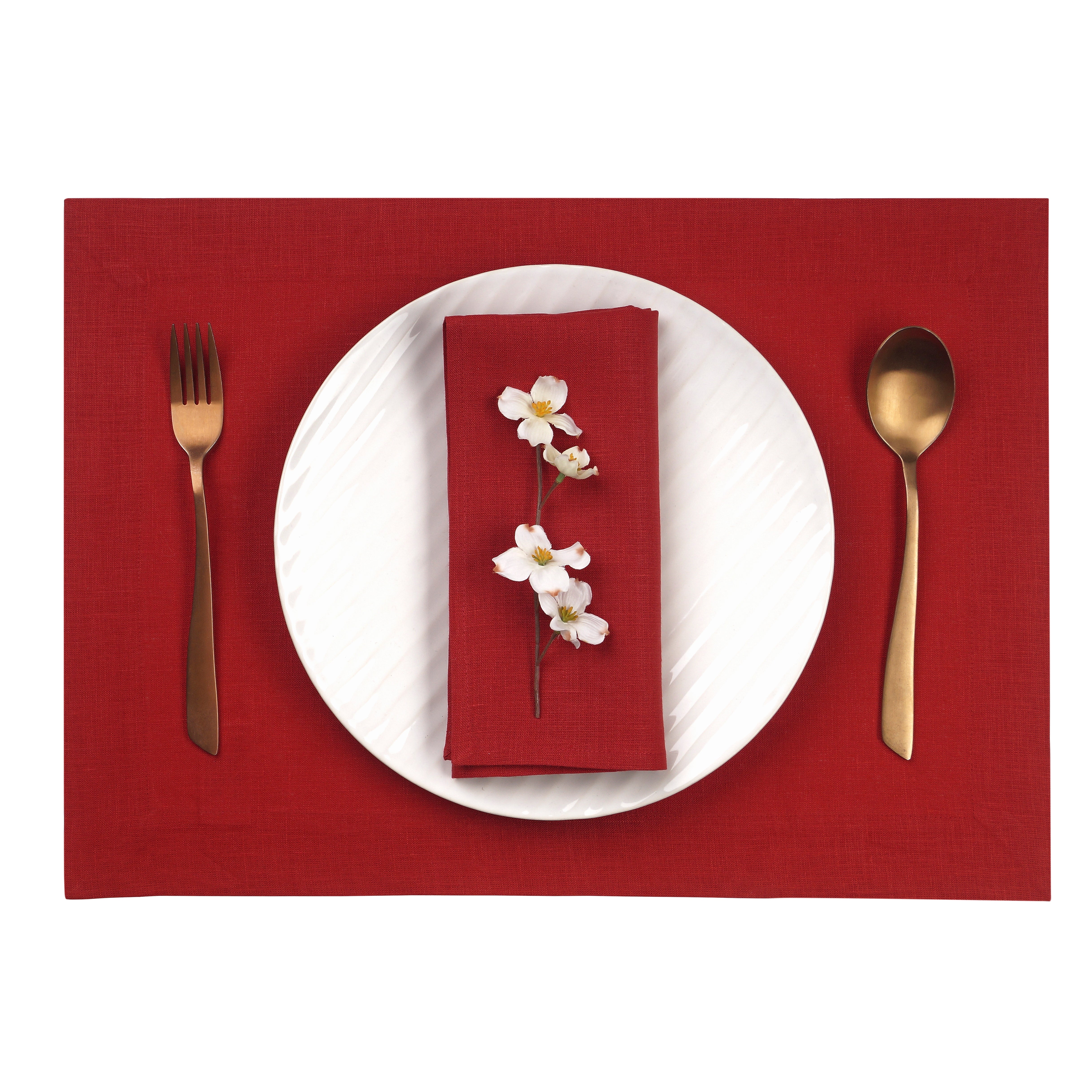 Close-up of the hemmed edge on red linen placemats