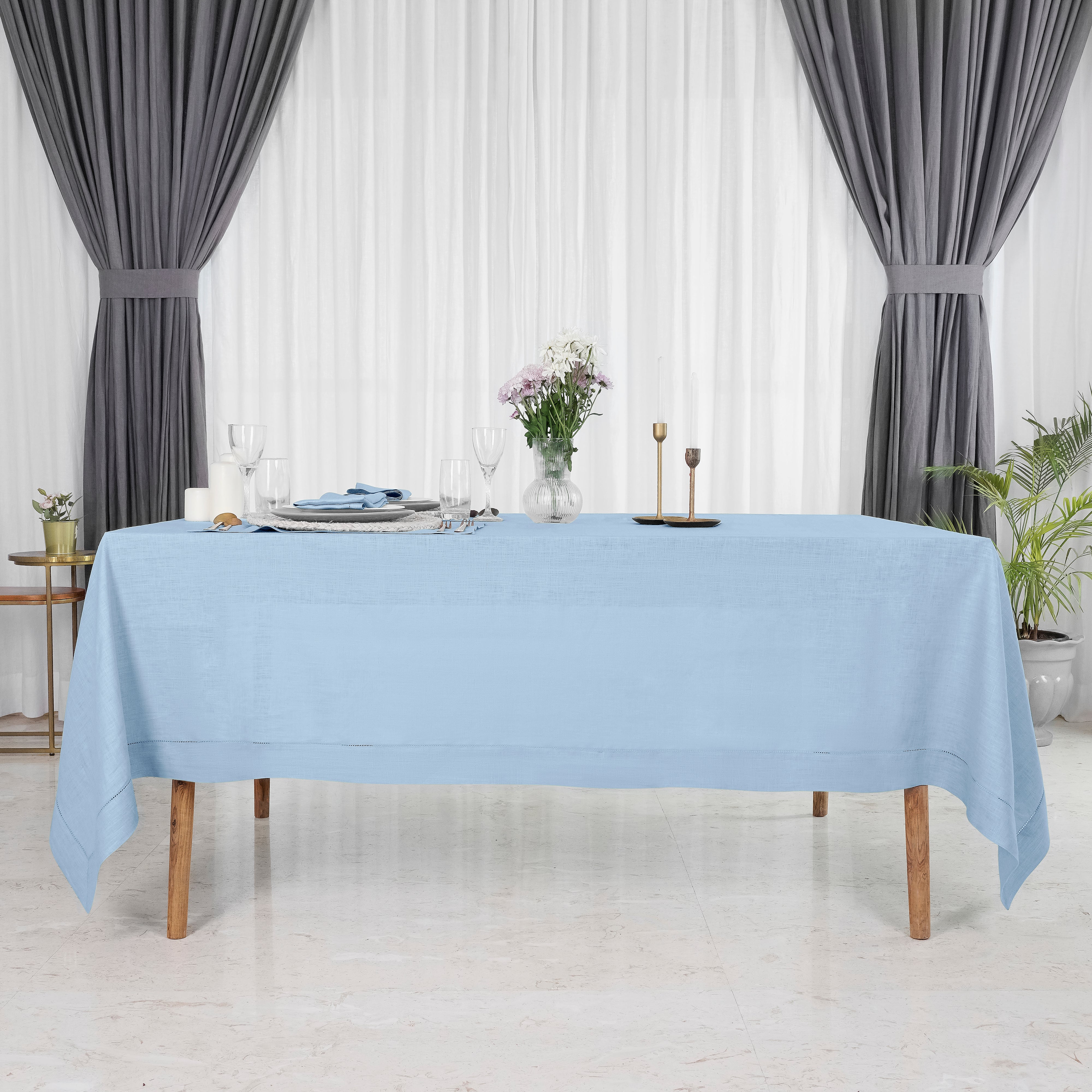 Close-up of the hemstitch edge on a powder blue pure linen tablecloth