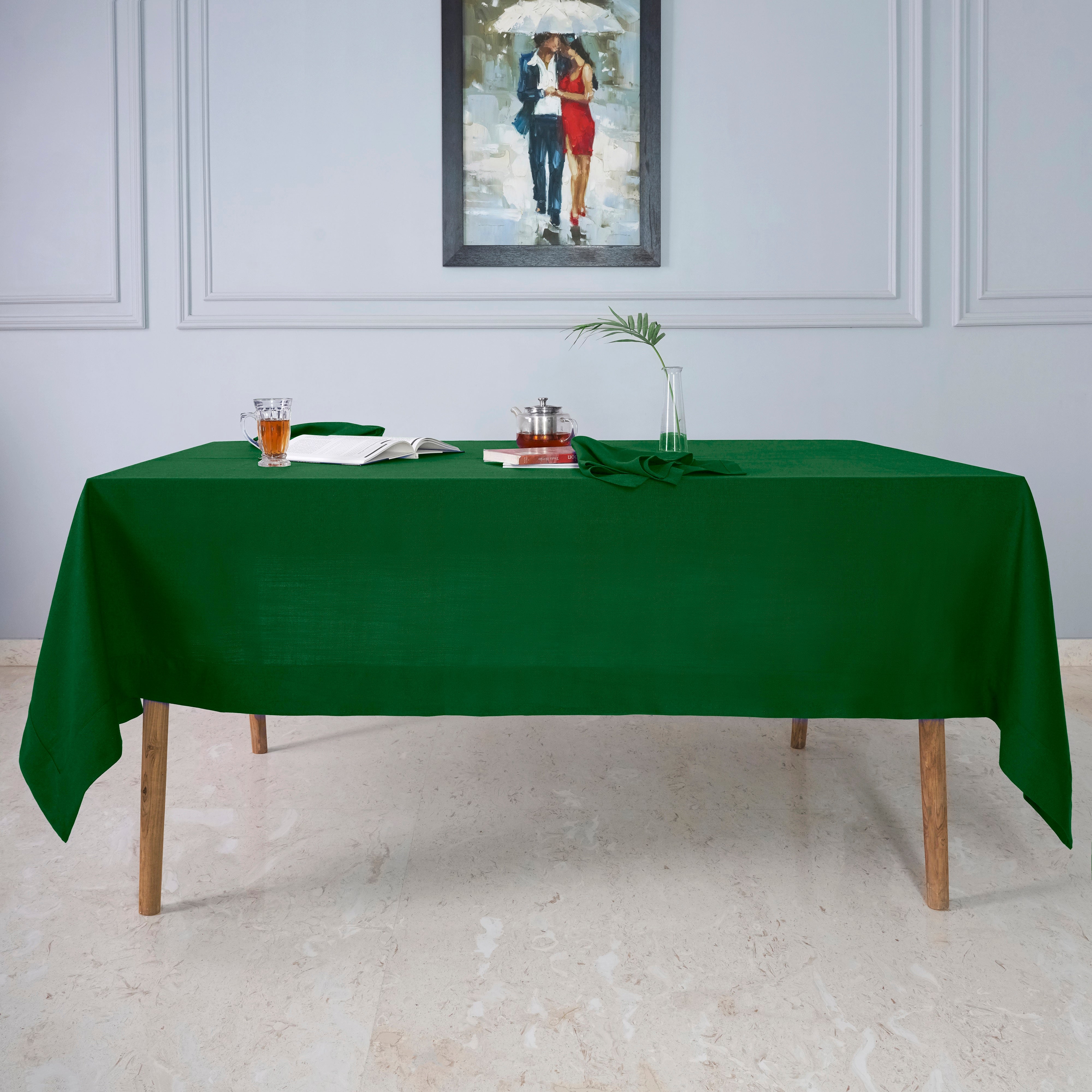 Close-up of the mitered corners on an eden green faux linen tablecloth