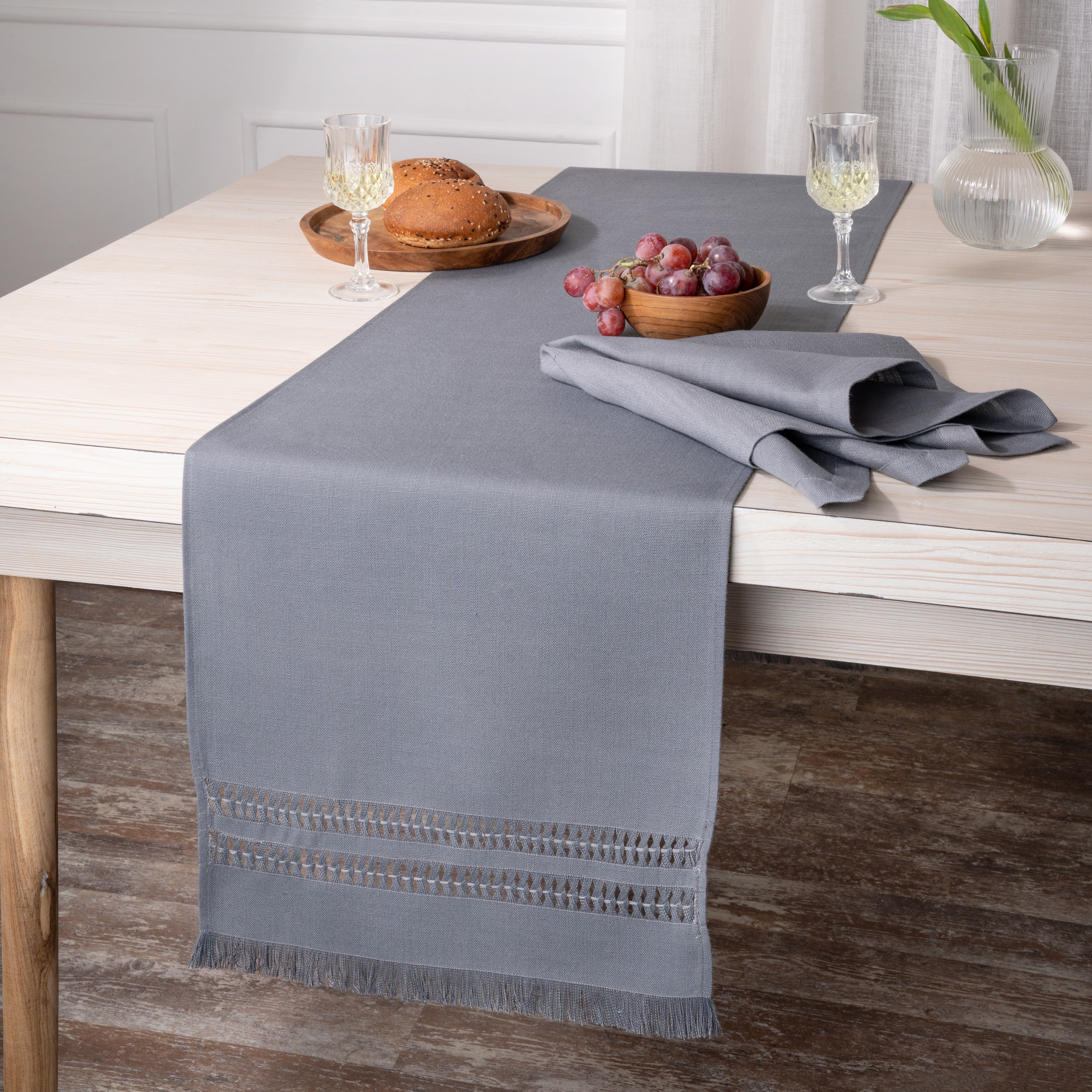 Close-up of the hand-hemstitch edge on a charcoal grey faux linen table runner