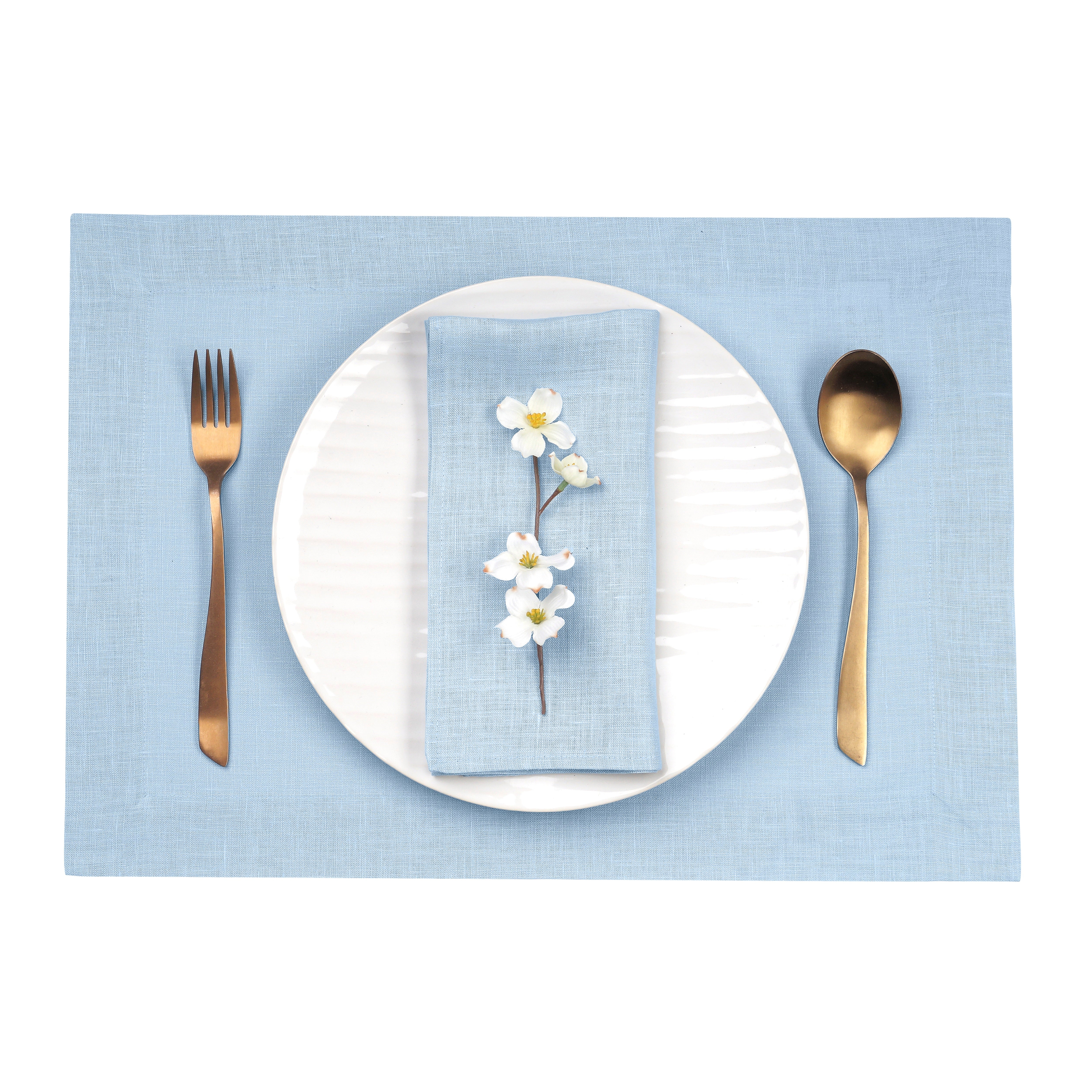 Close-up of the mitered corners on powder blue pure linen placemats