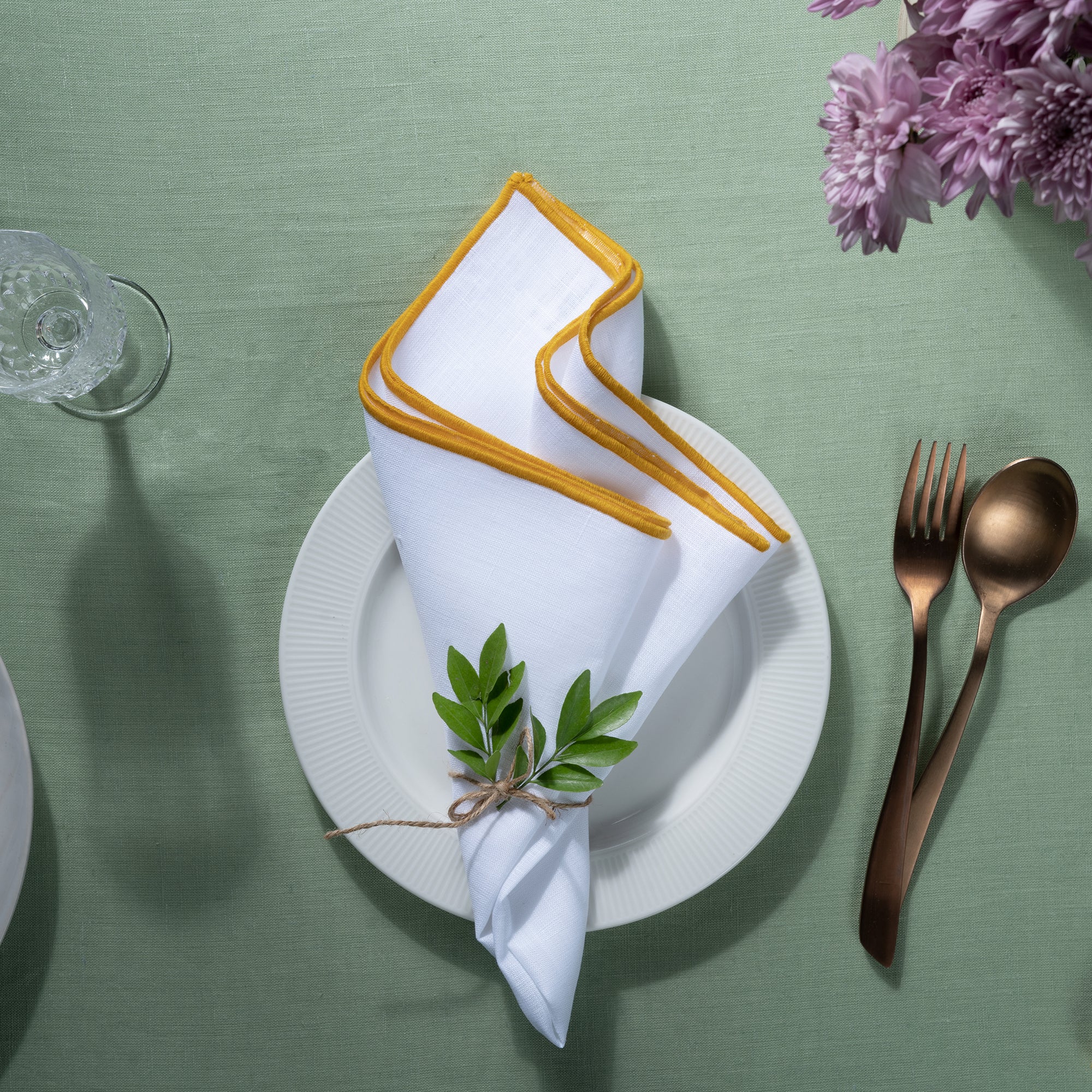 White and yellow pure linen dinner napkins with matching D'Moksha table linens