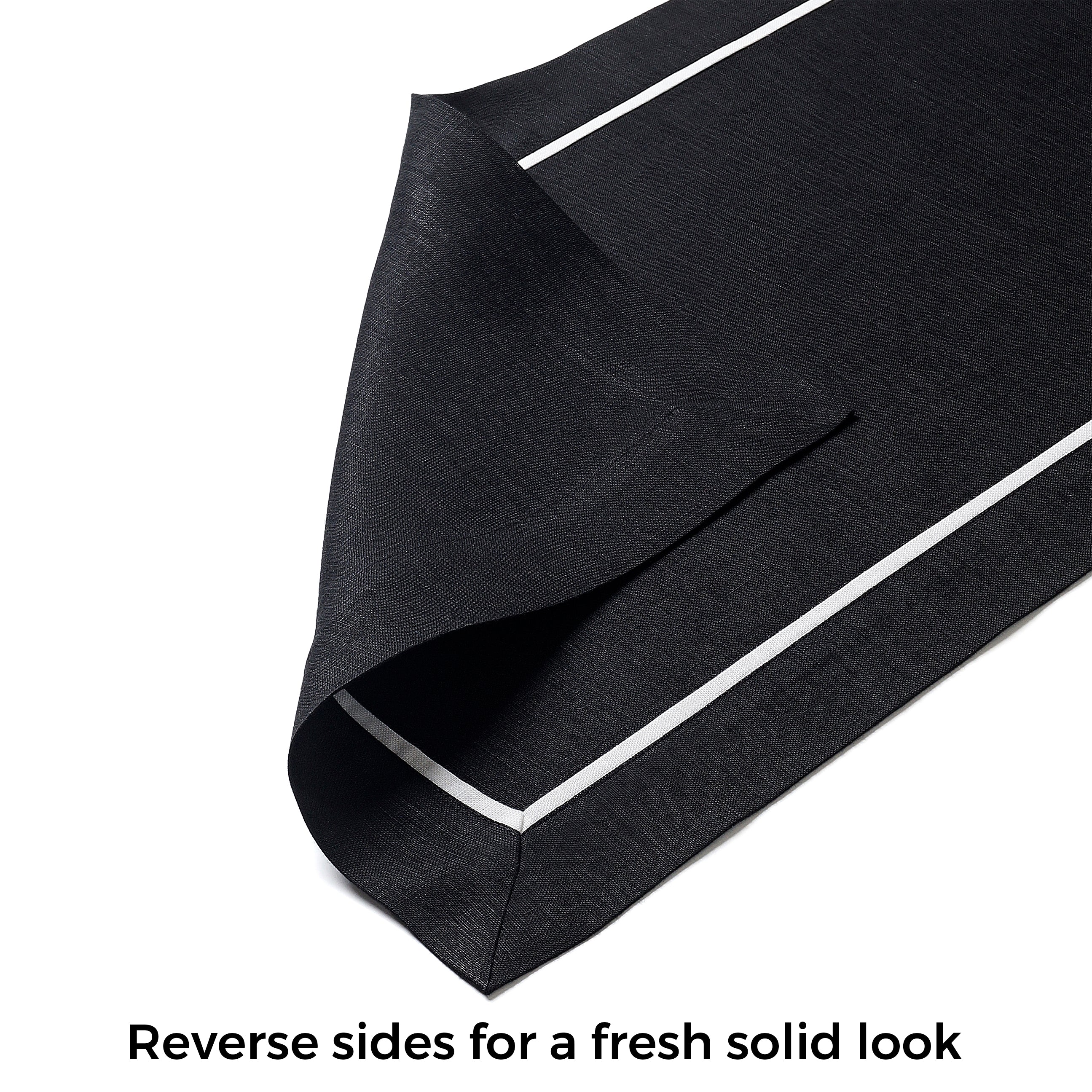 Close-up of the reversible design on a black and white pure linen table runner