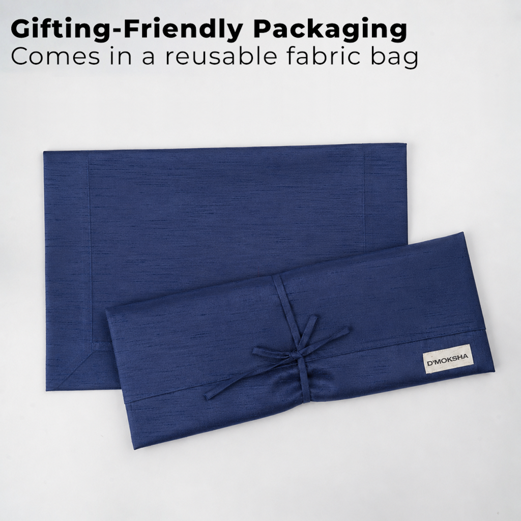 Navy blue Luxe Shine placemats with matching D'Moksha table linens