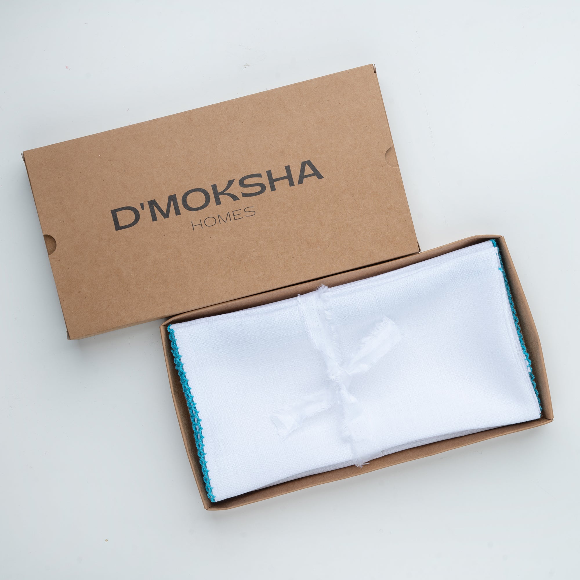 White and blue pure linen dinner napkins with matching D'Moksha table linens