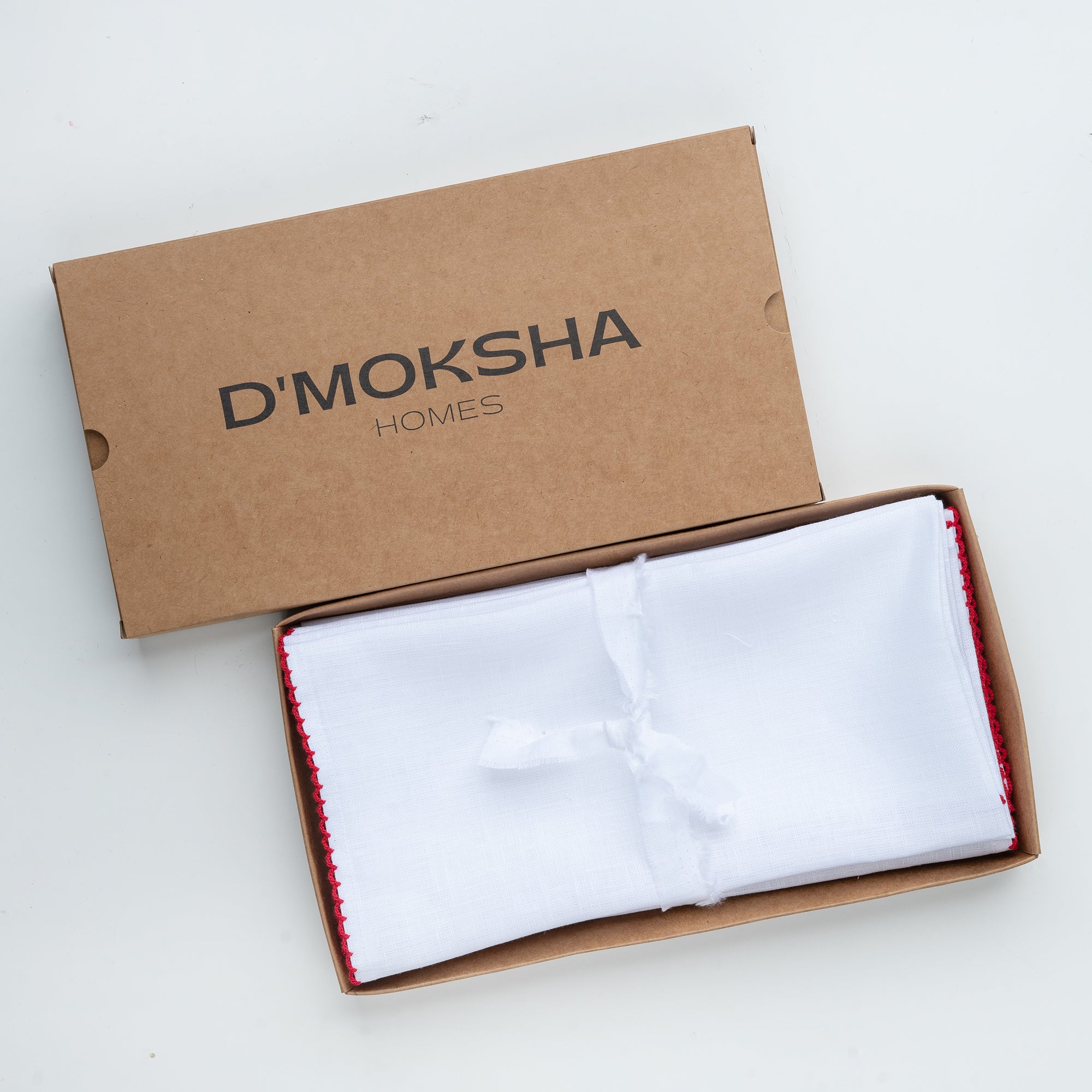 White and red pure linen dinner napkins folded to show fabric texture