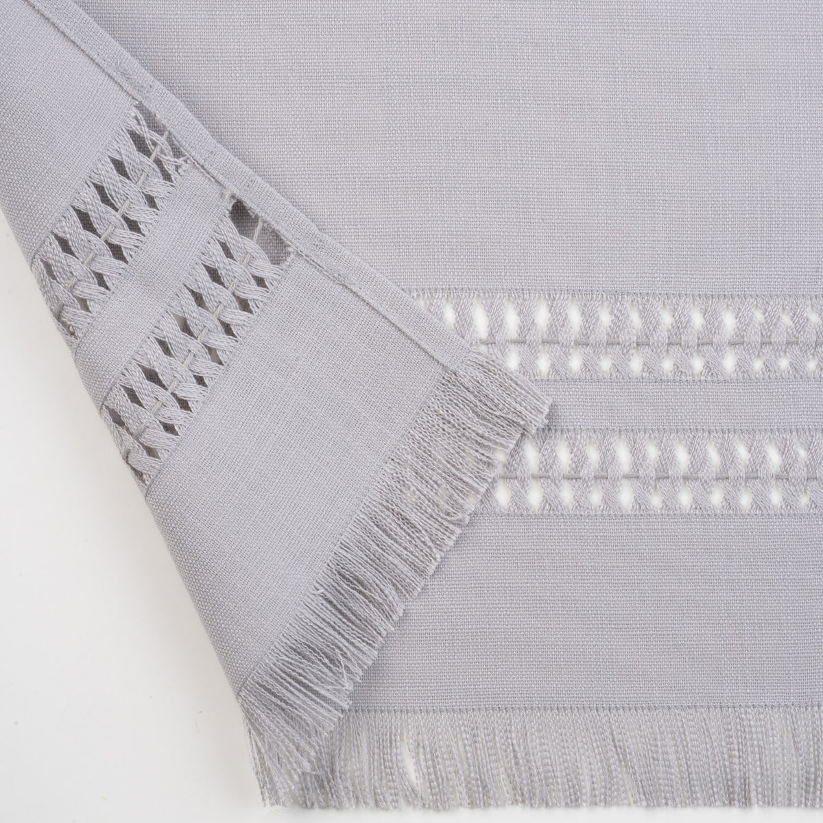 Light grey faux linen table runner with matching D'Moksha table linens