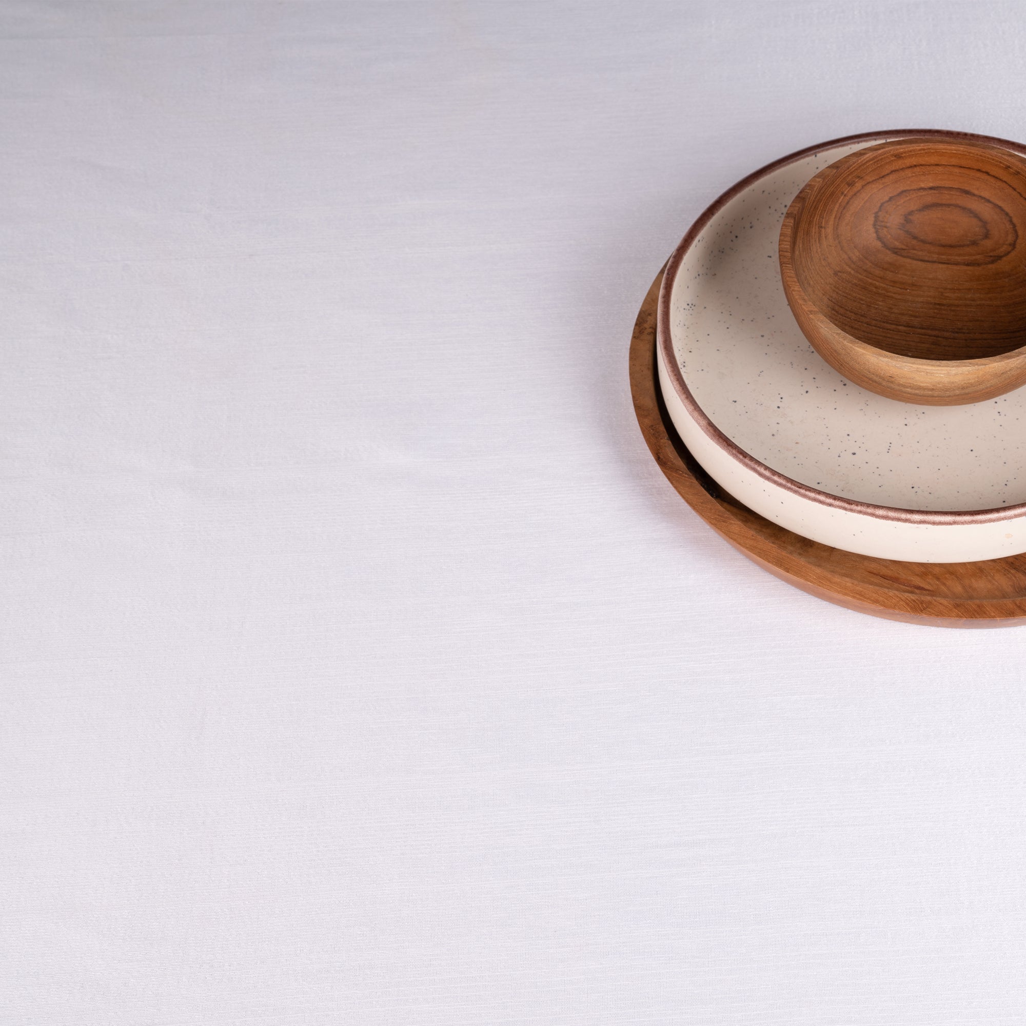 White Luxe Shine tablecloth with matching D'Moksha table linens