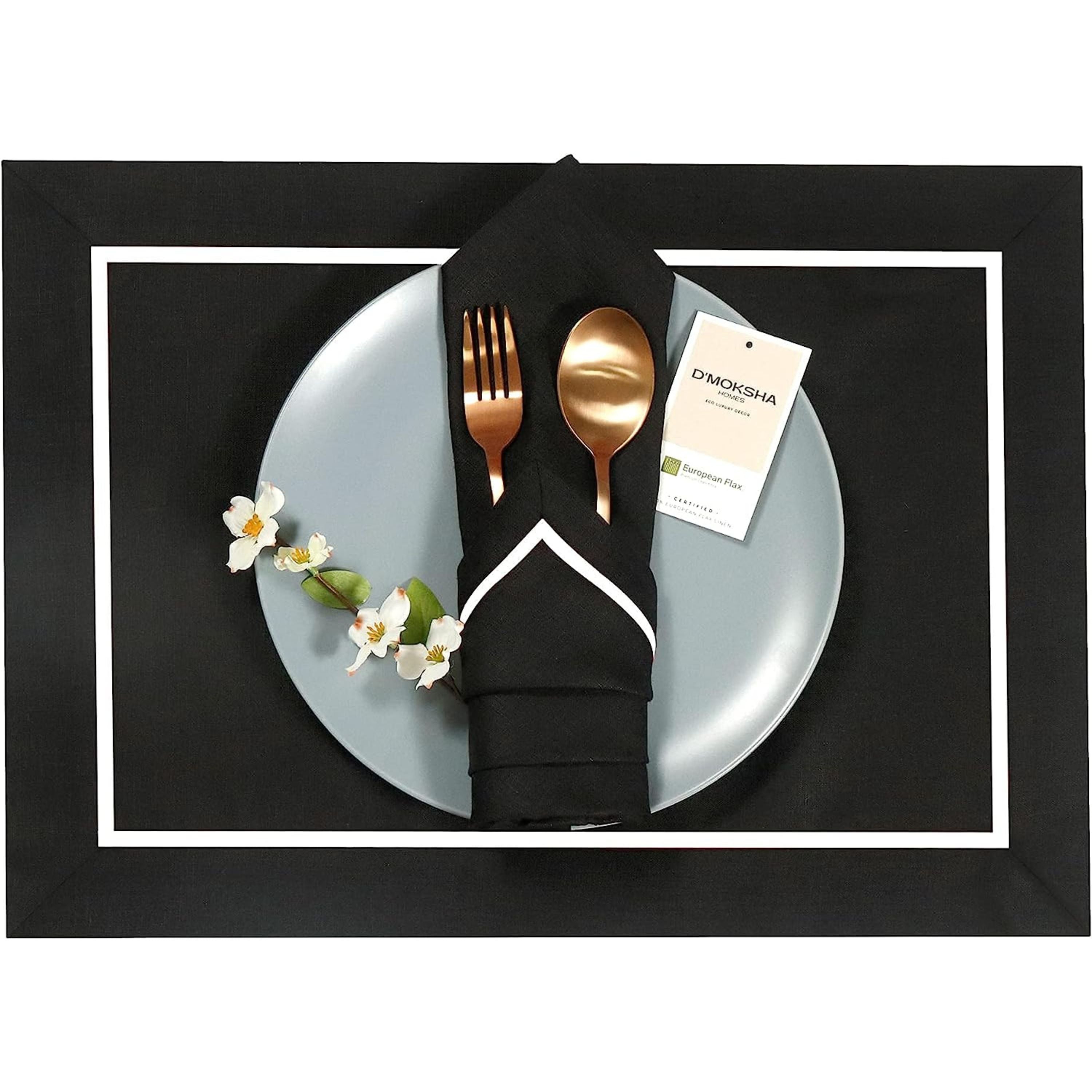 Black and white pure linen dinner napkins folded to show fabric texture