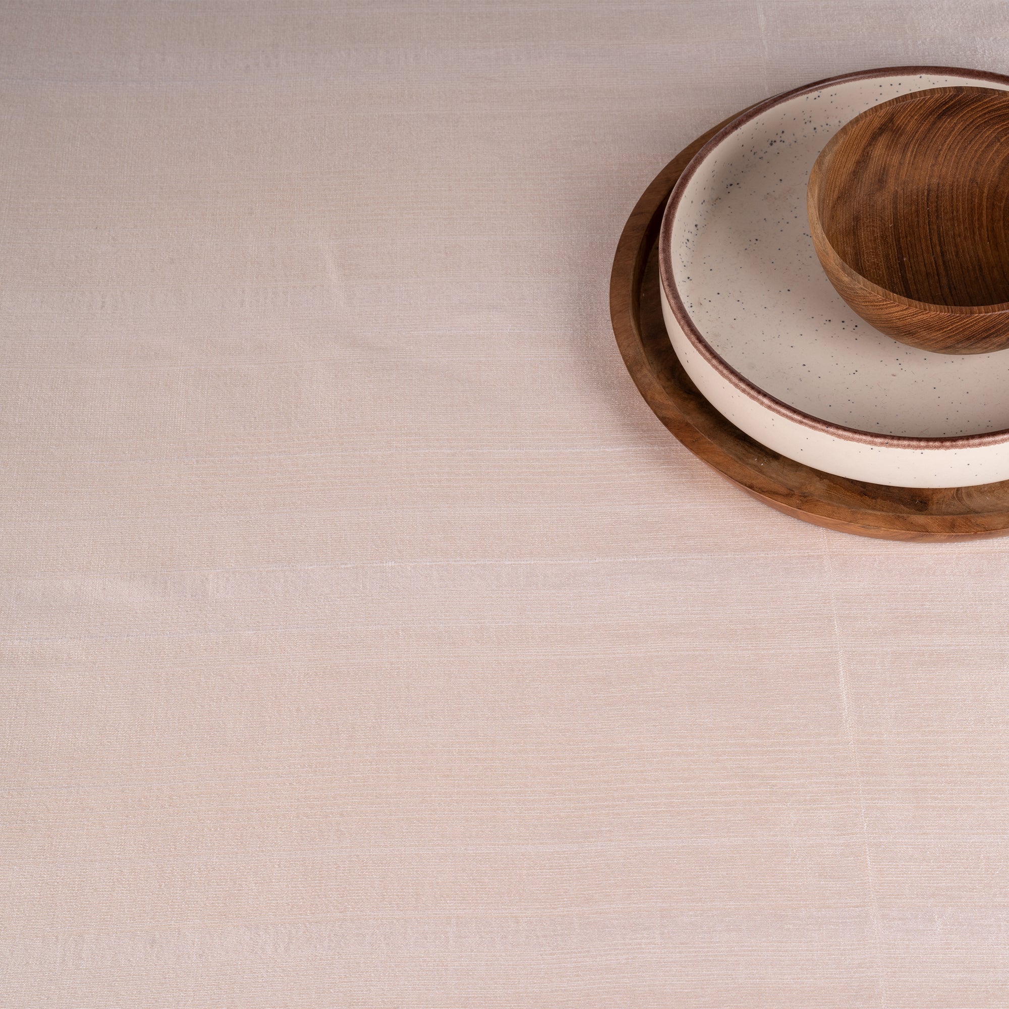 Light natural Luxe Shine tablecloth with matching D'Moksha table linens