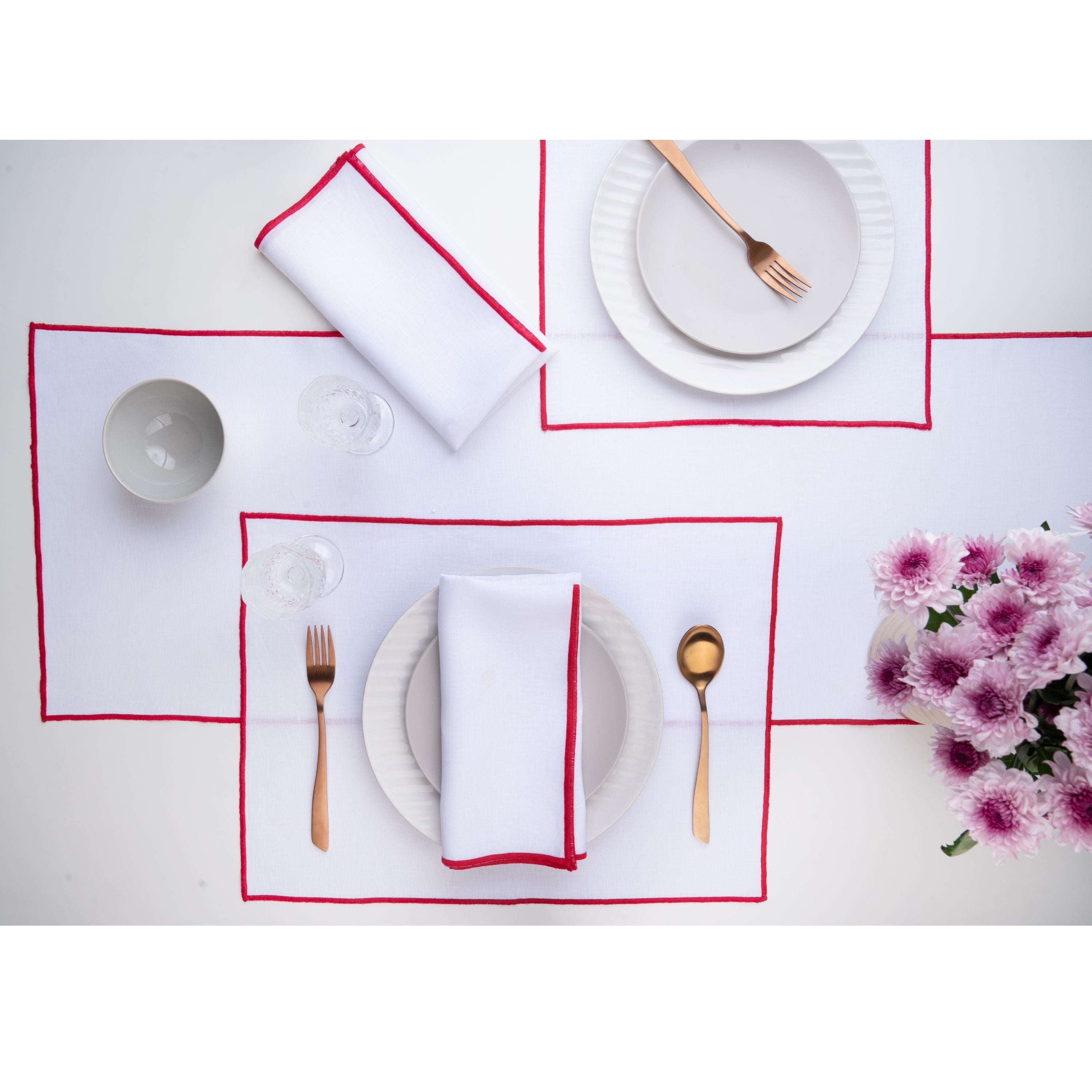 White and red pure linen placemats folded to show fabric texture