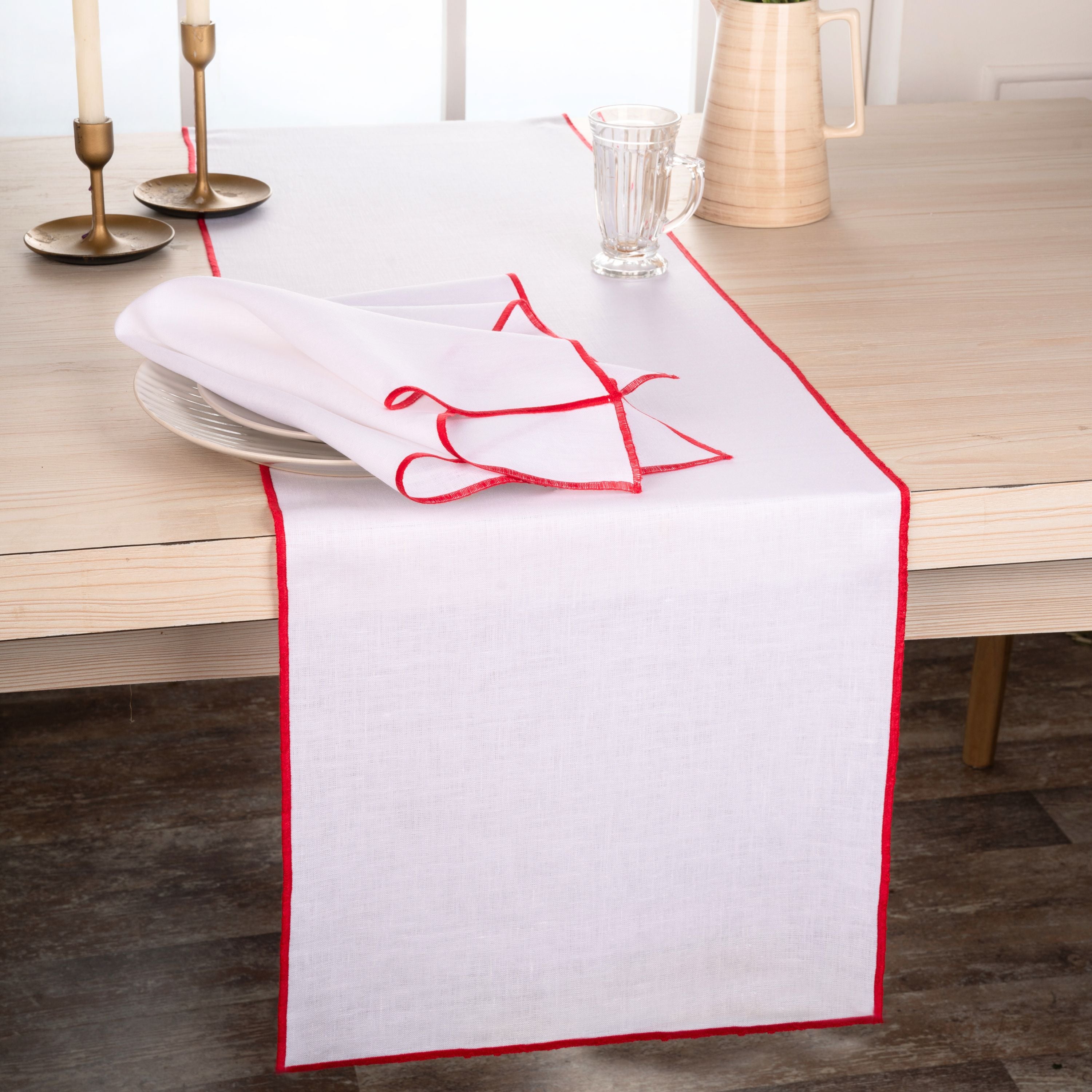 Close-up of the marrow edge on a white and red pure linen table runner