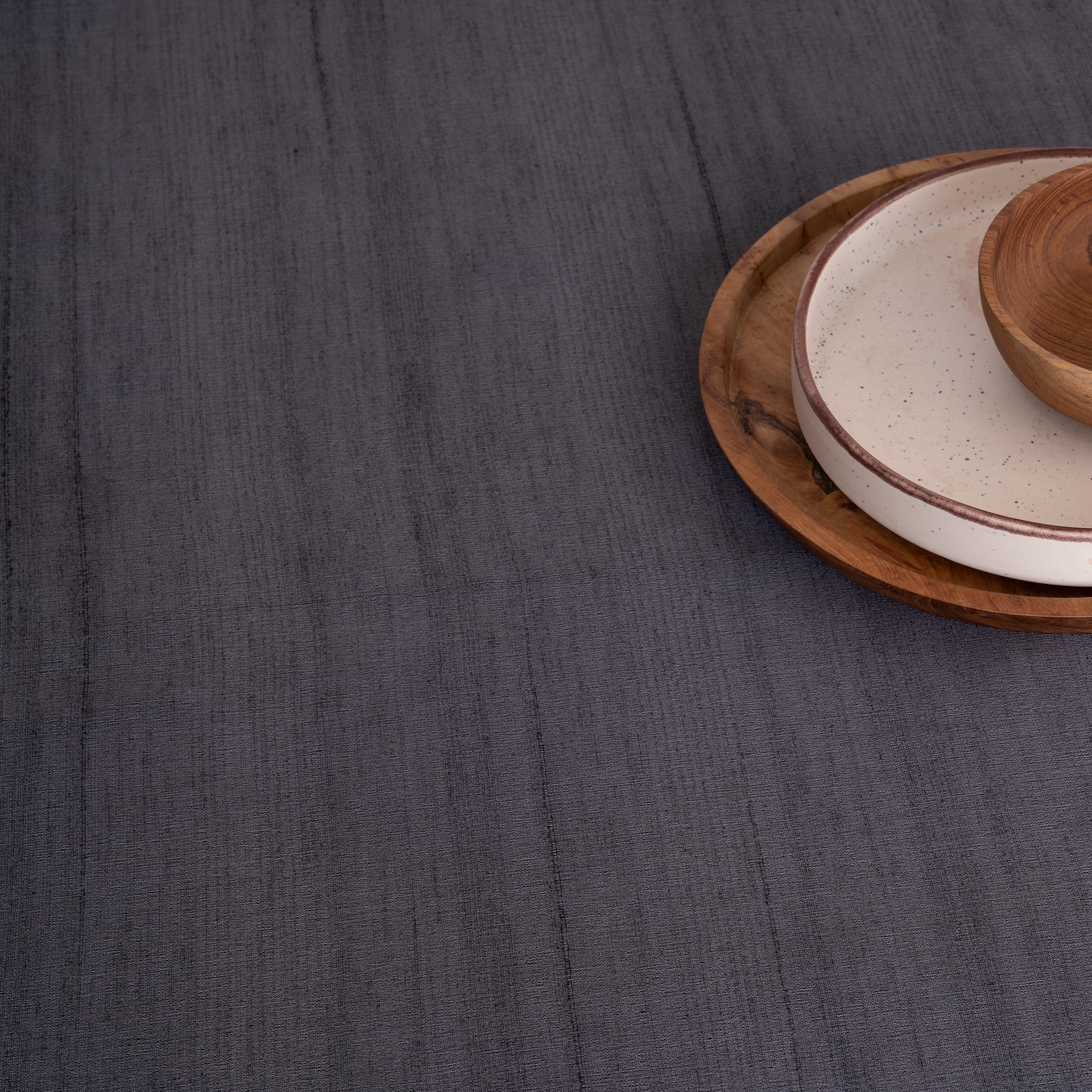 Charcoal grey Luxe Shine tablecloth with matching D'Moksha table linens