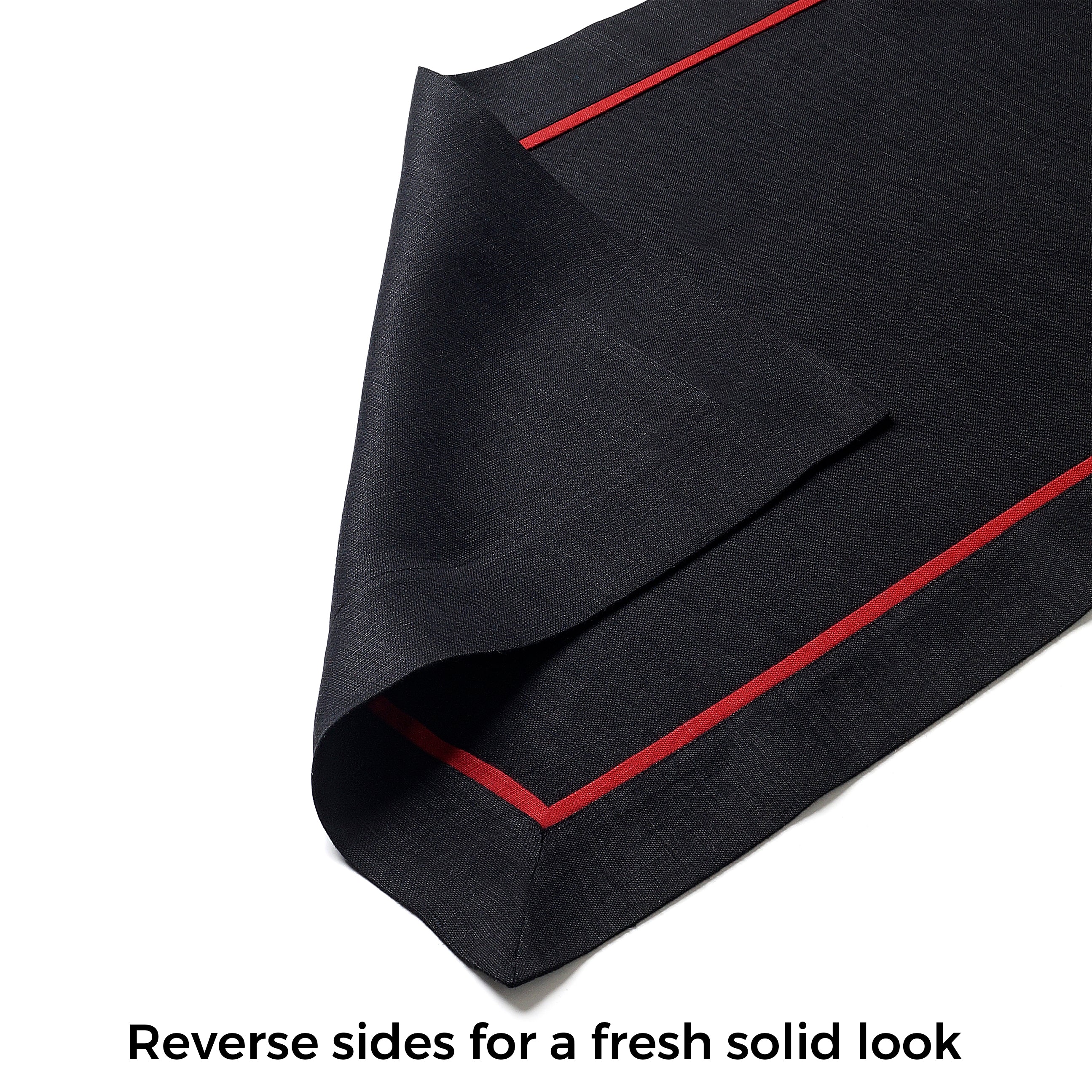 Close-up of the reversible design on a black and red pure linen table runner