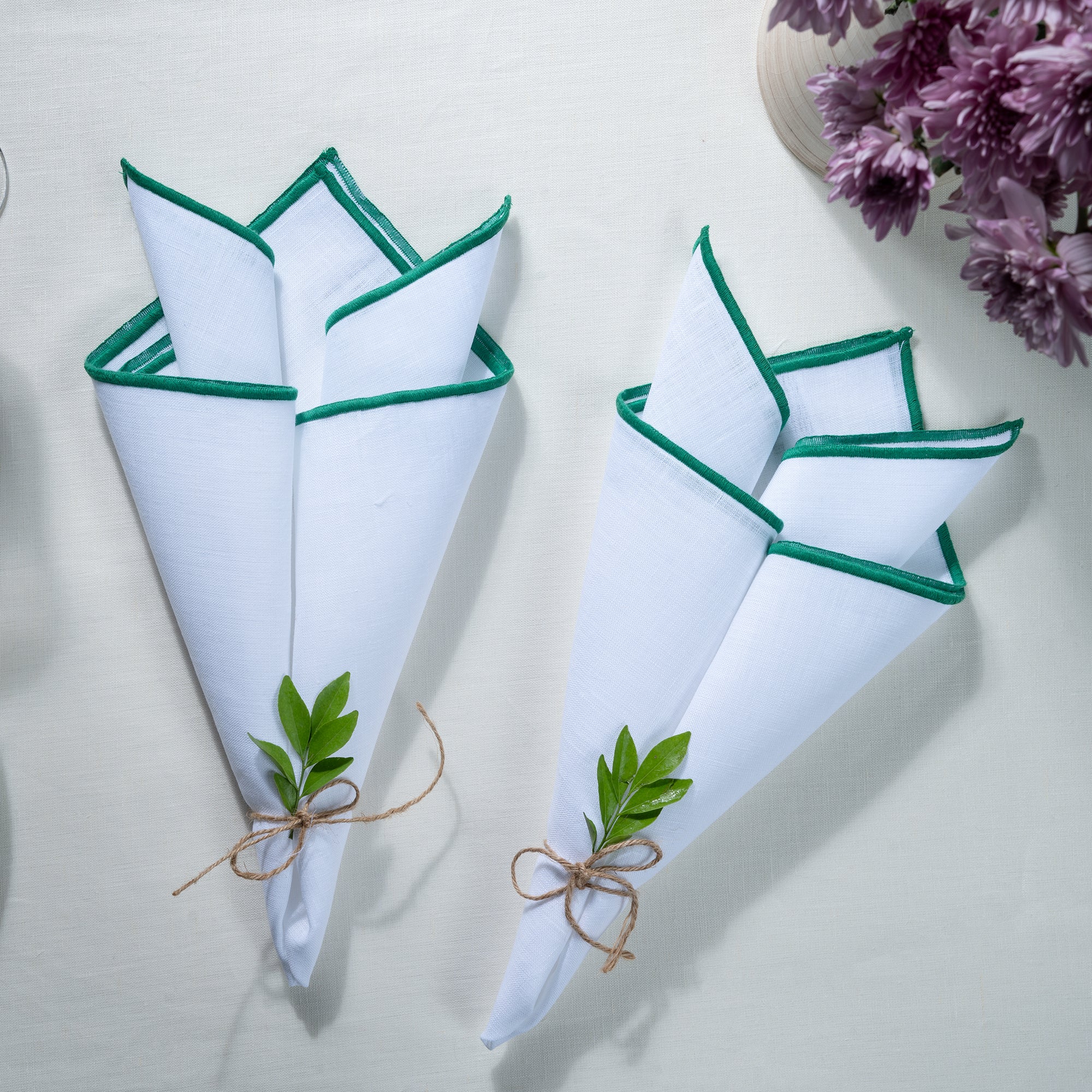 White and green pure linen dinner napkins with matching D'Moksha table linens