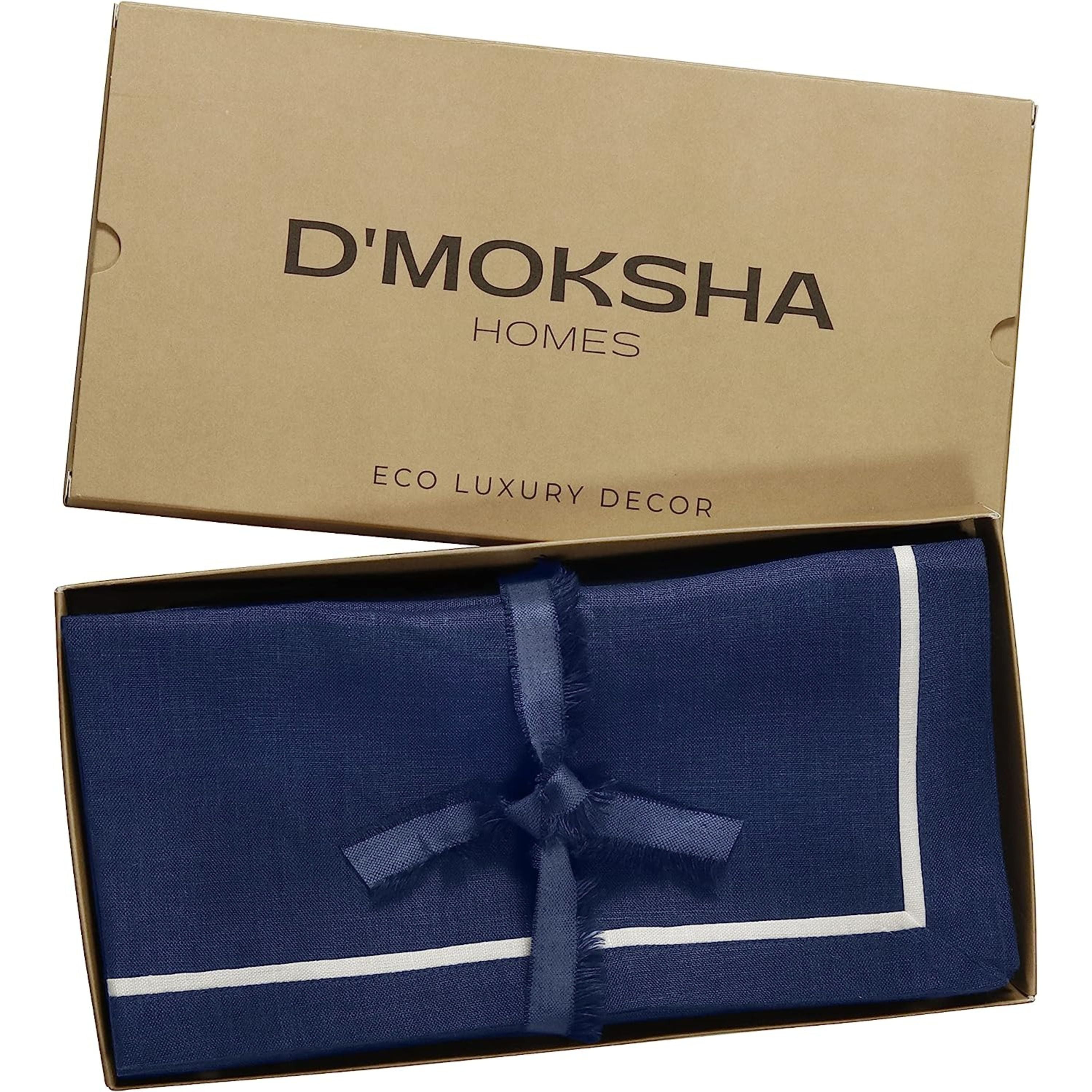 Navy blue and white pure linen dinner napkins folded to show fabric texture