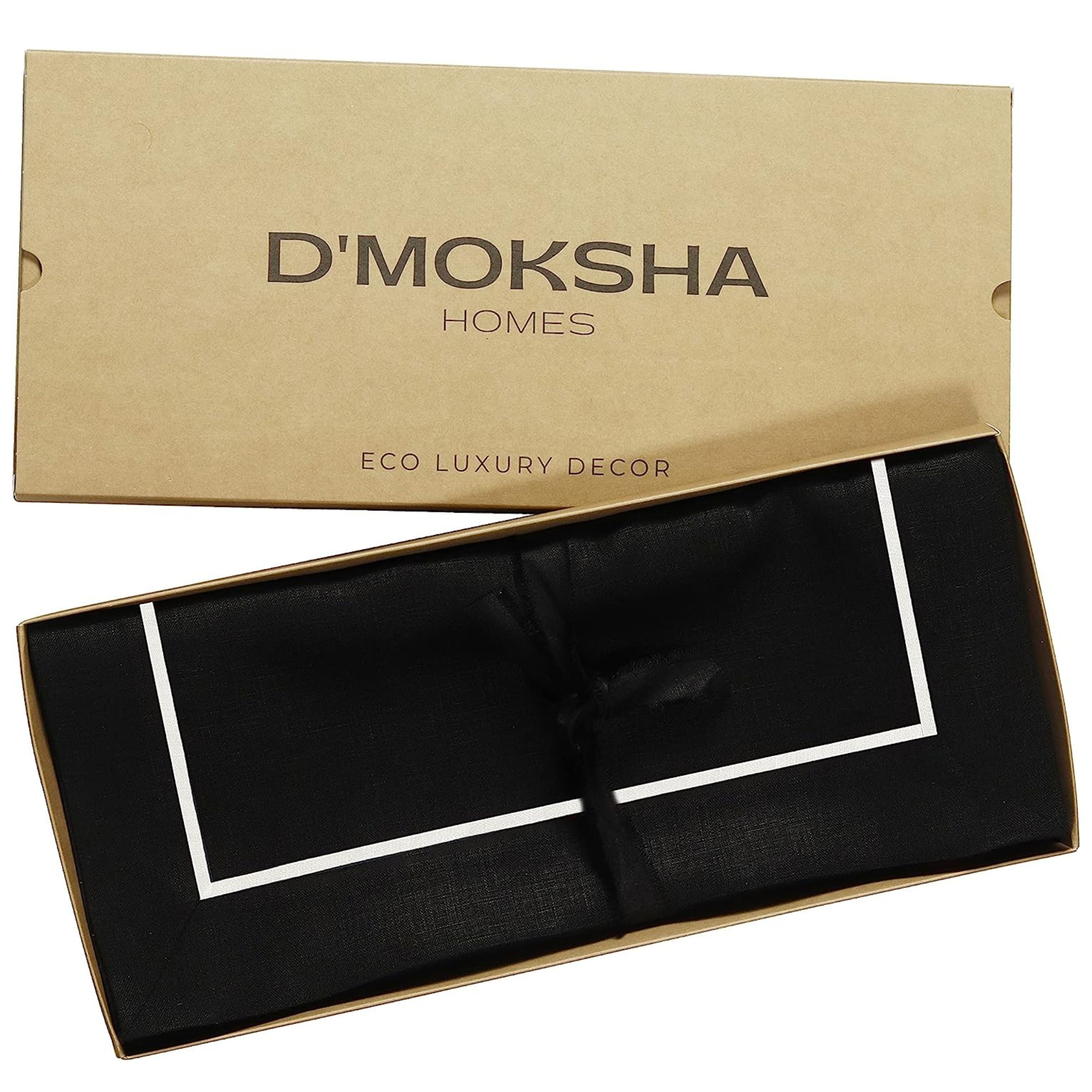 Black and white pure linen placemats folded to show fabric texture