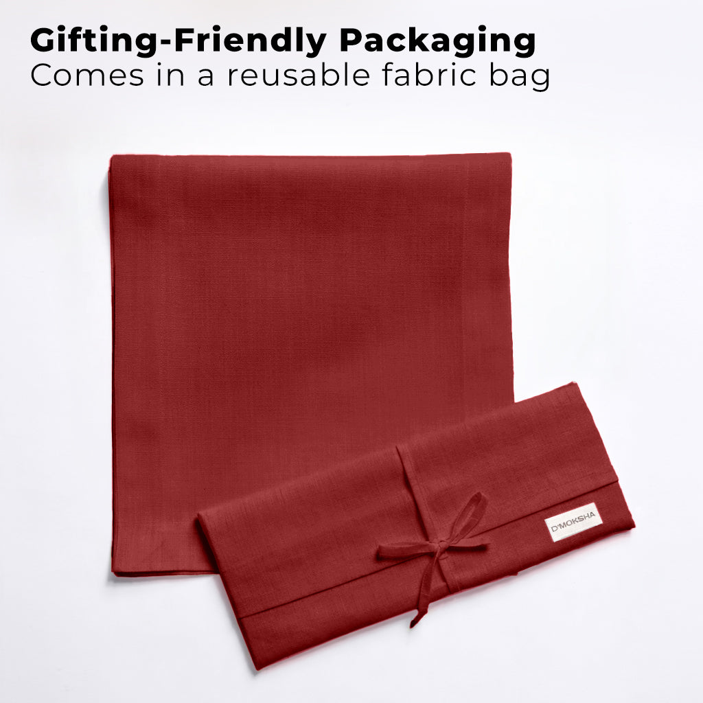 Red faux linen table runner with matching D'Moksha table linens