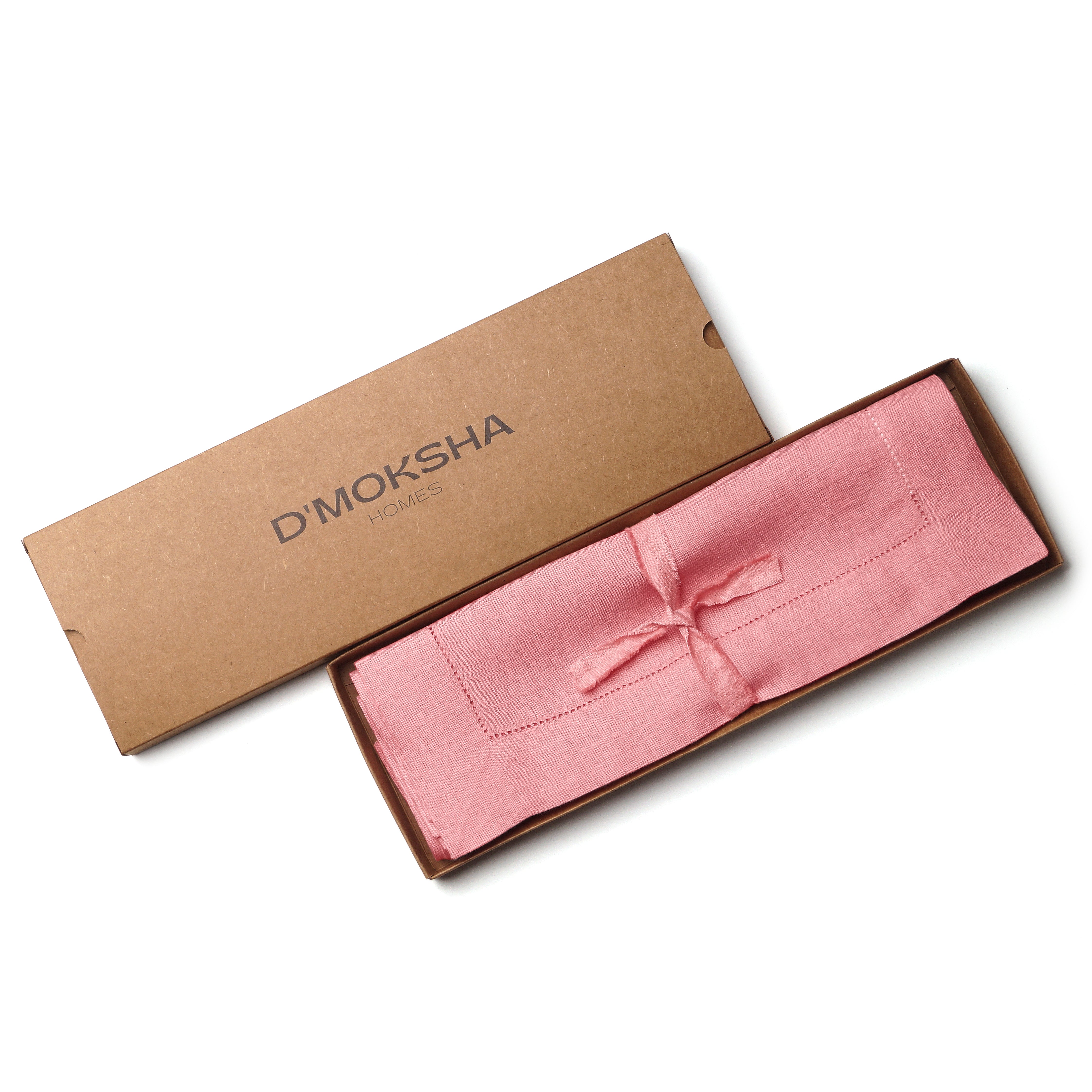 Dusty pink pure linen placemats folded to show fabric texture