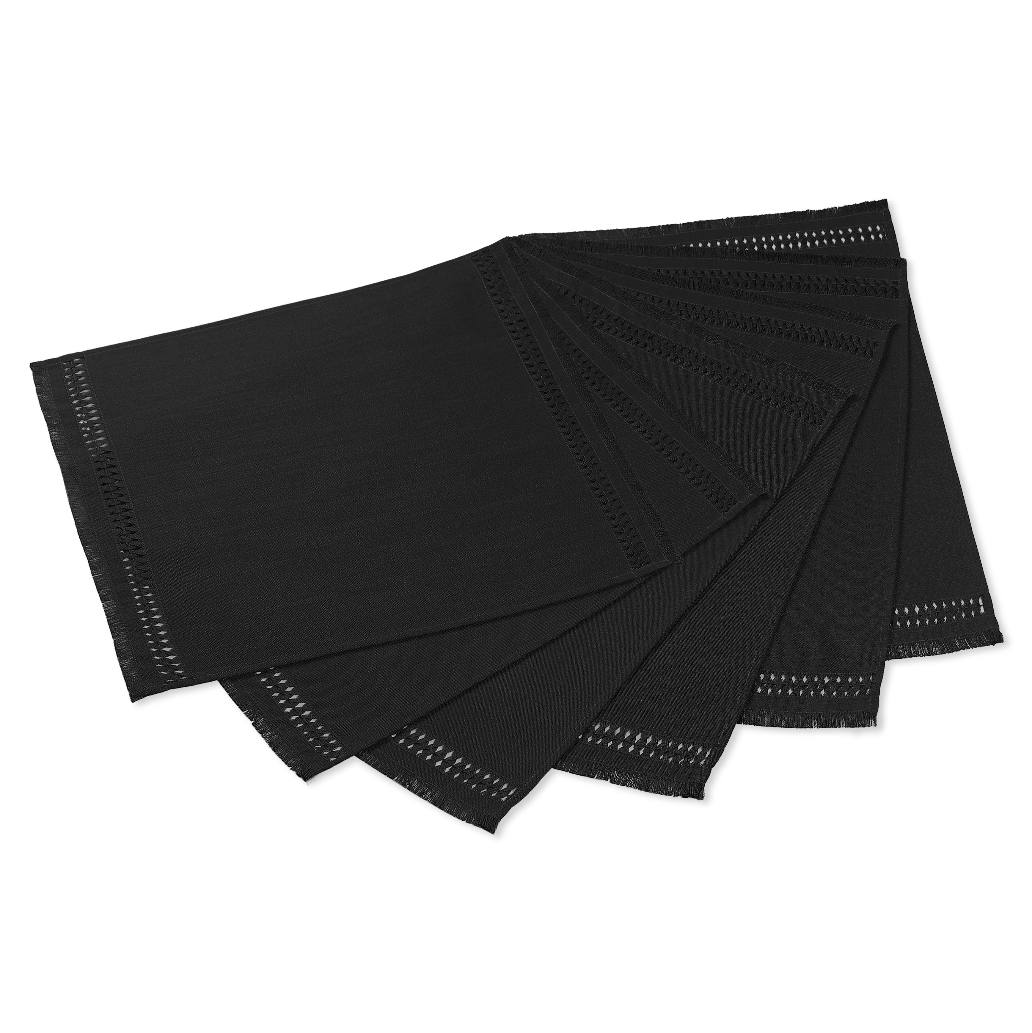 Black faux linen placemats folded to show fabric texture