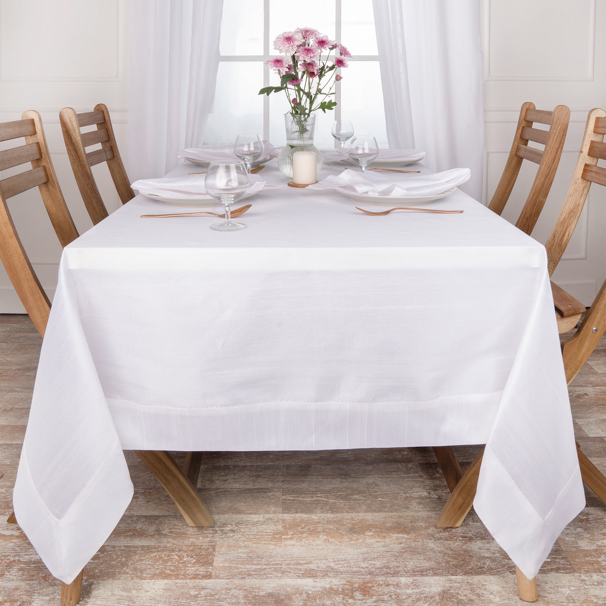 White Luxe Shine tablecloth folded to show fabric texture