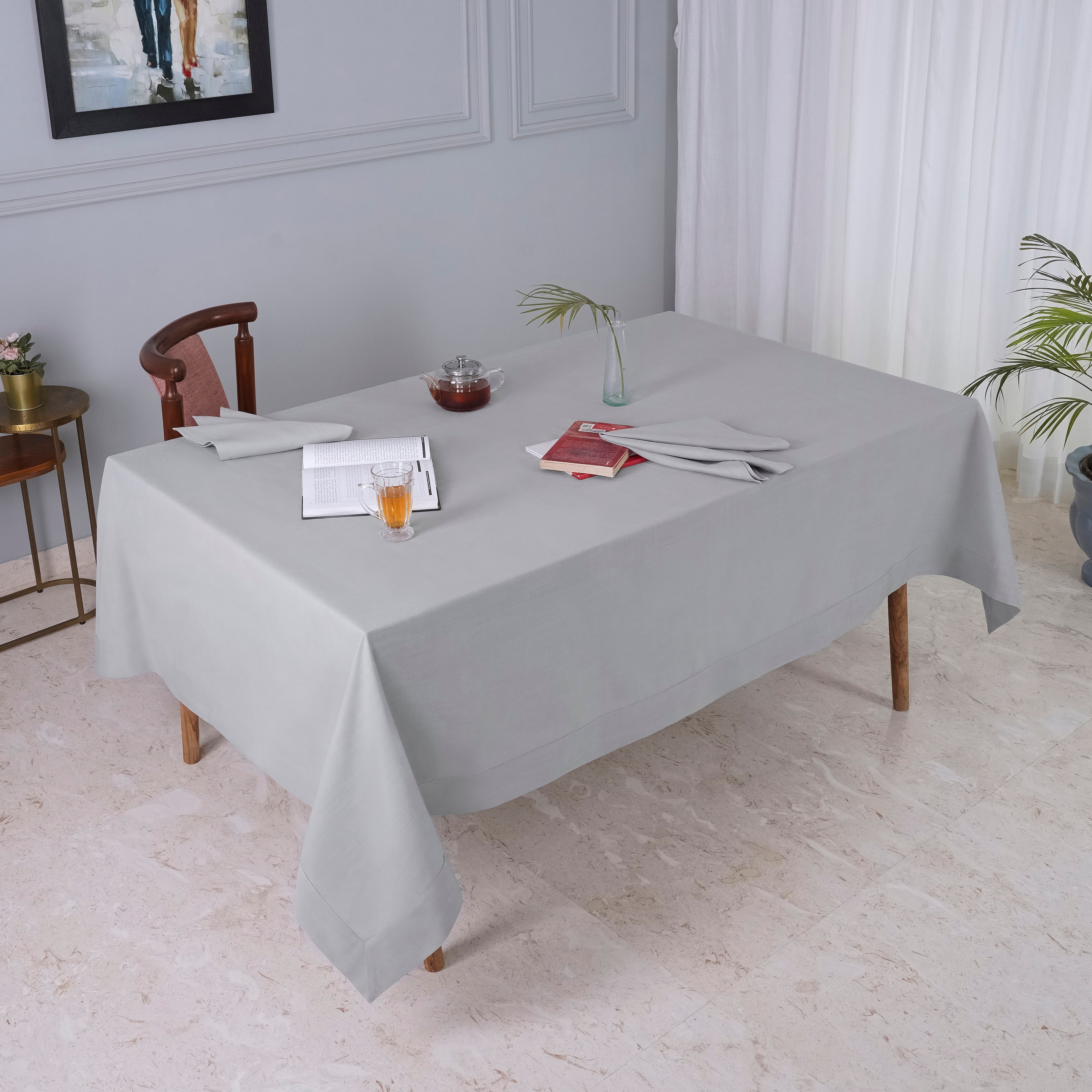 Light grey faux linen tablecloth folded to show fabric texture