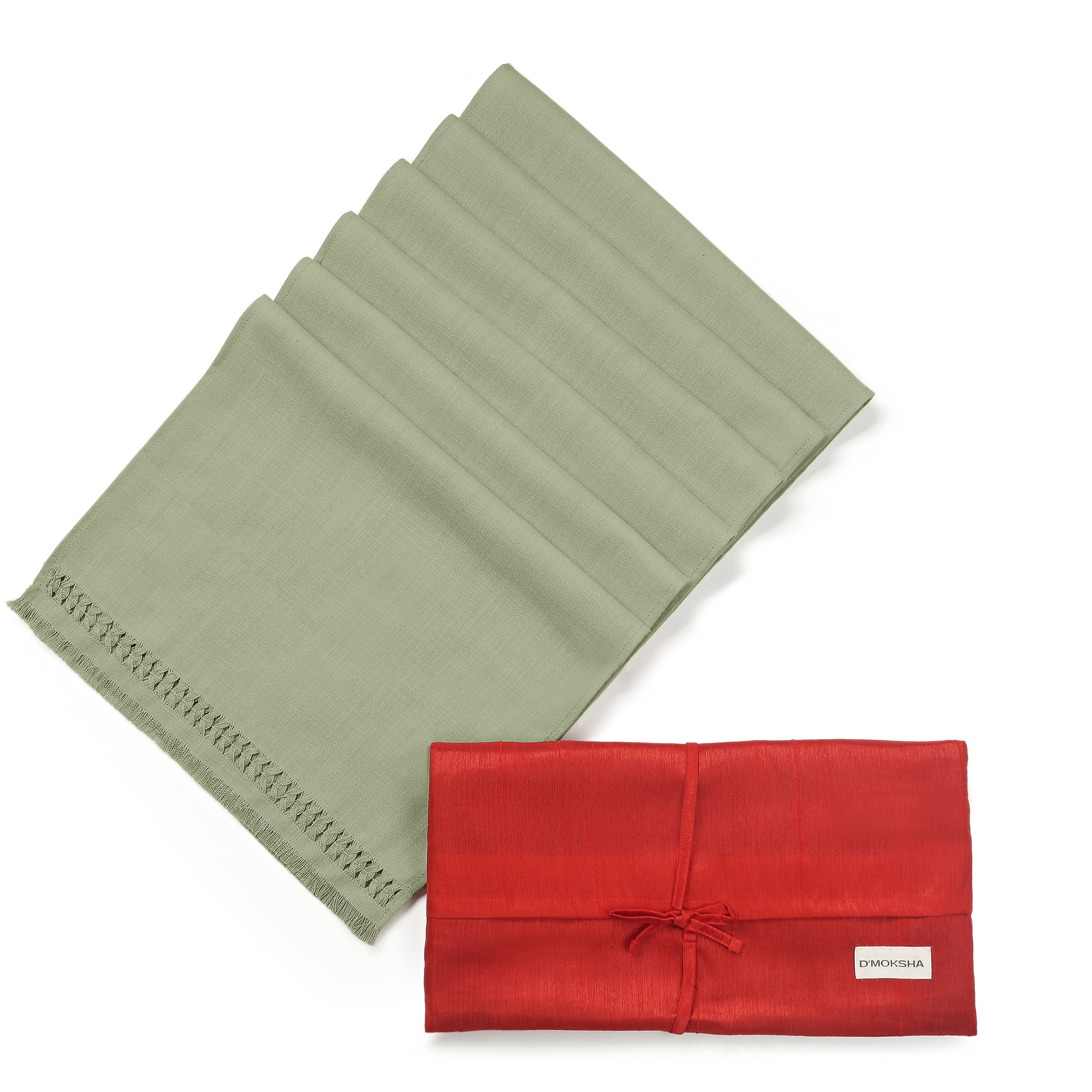 Sage green faux linen dinner napkins folded to show fabric texture