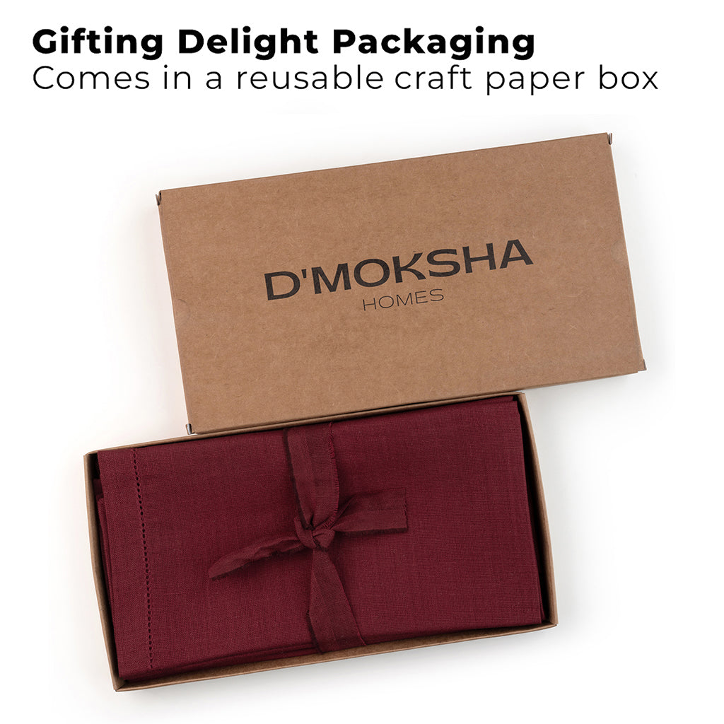 Dark red pure linen dinner napkins folded to show fabric texture