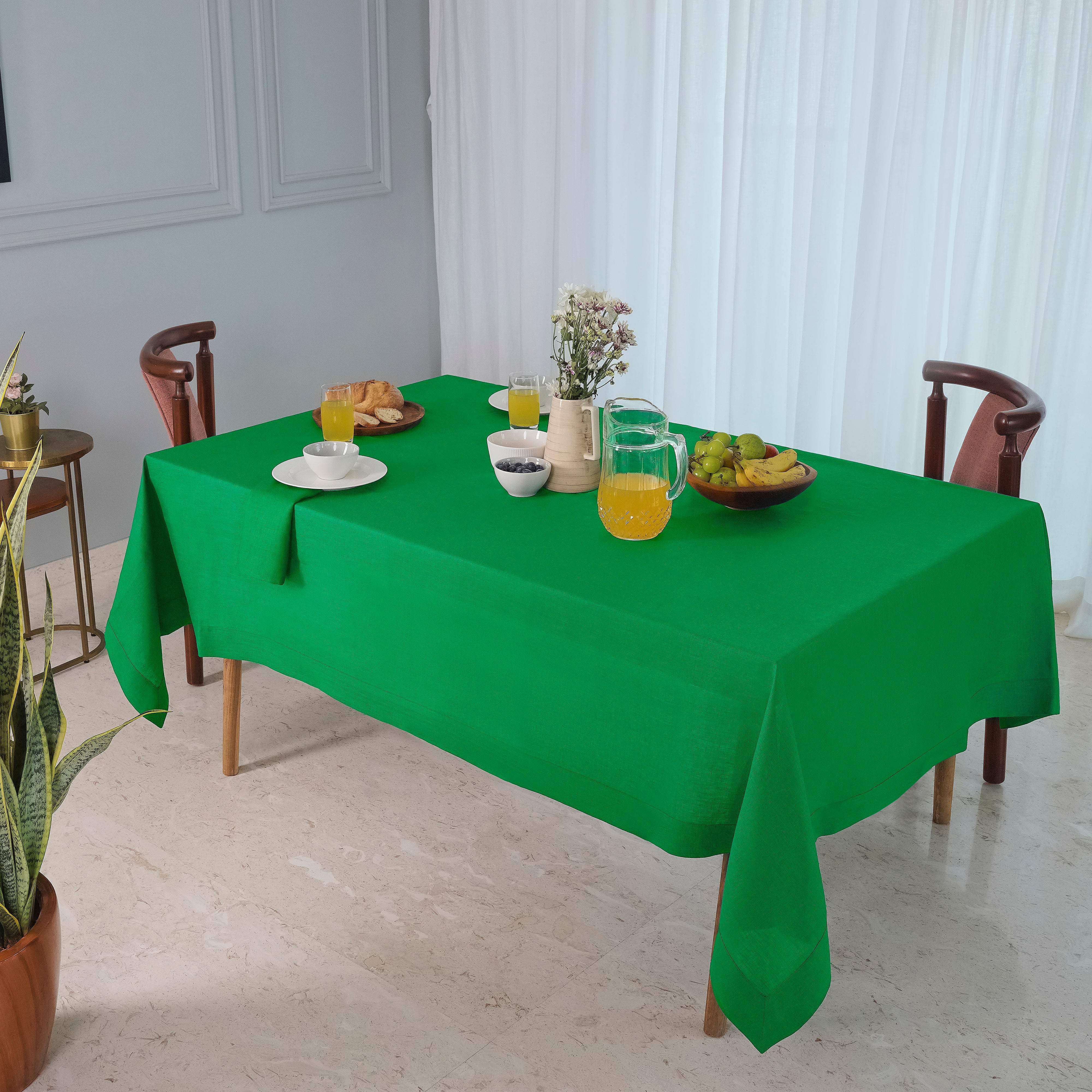 Kelly green pure linen tablecloth folded to show fabric texture