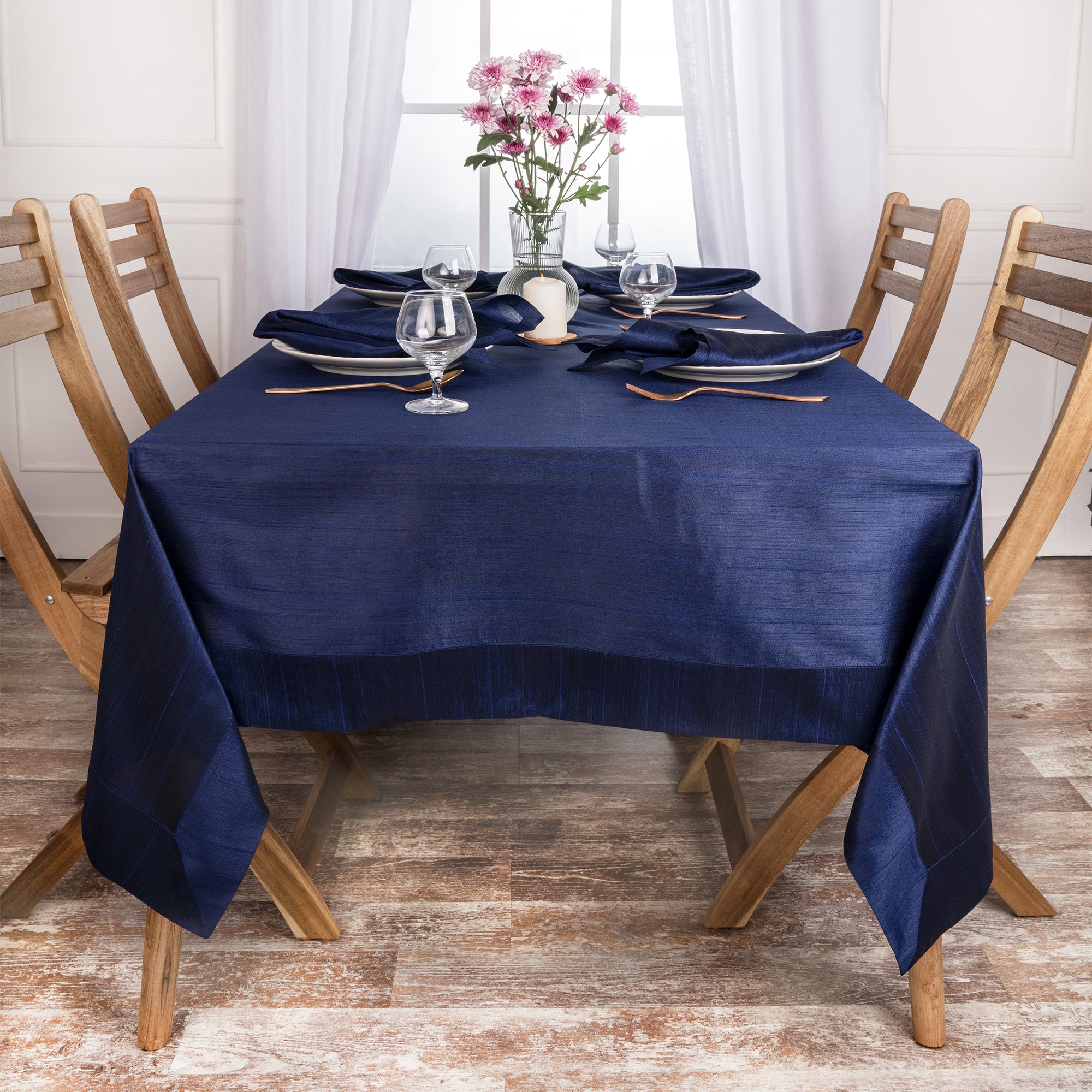Navy blue Luxe Shine tablecloth folded to show fabric texture