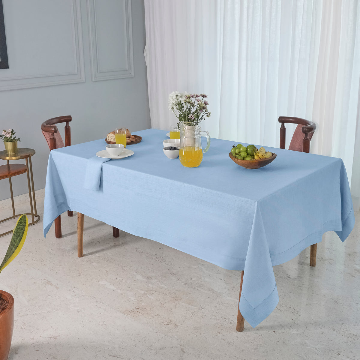 Powder blue pure linen tablecloth folded to show fabric texture