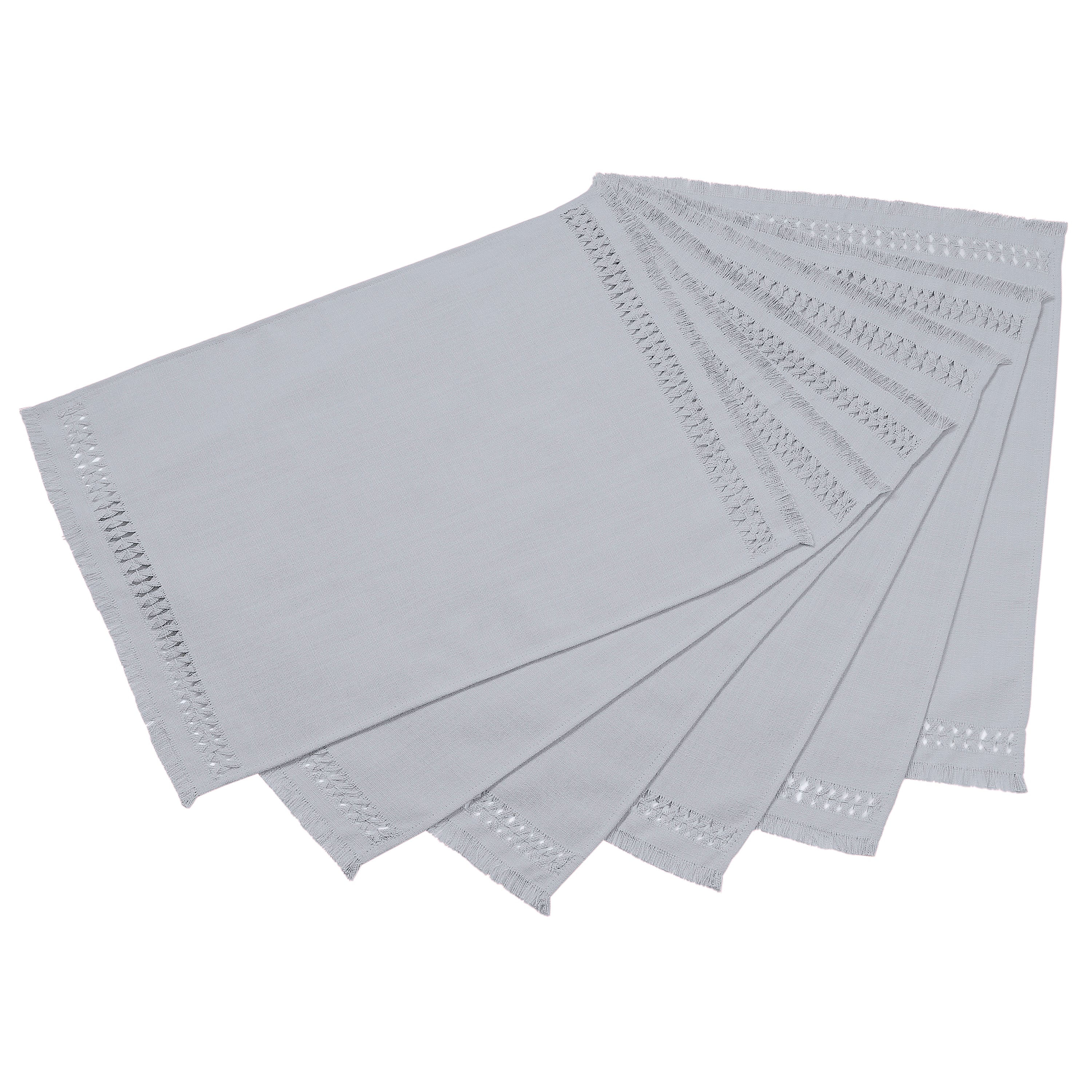 Light grey faux linen placemats folded to show fabric texture