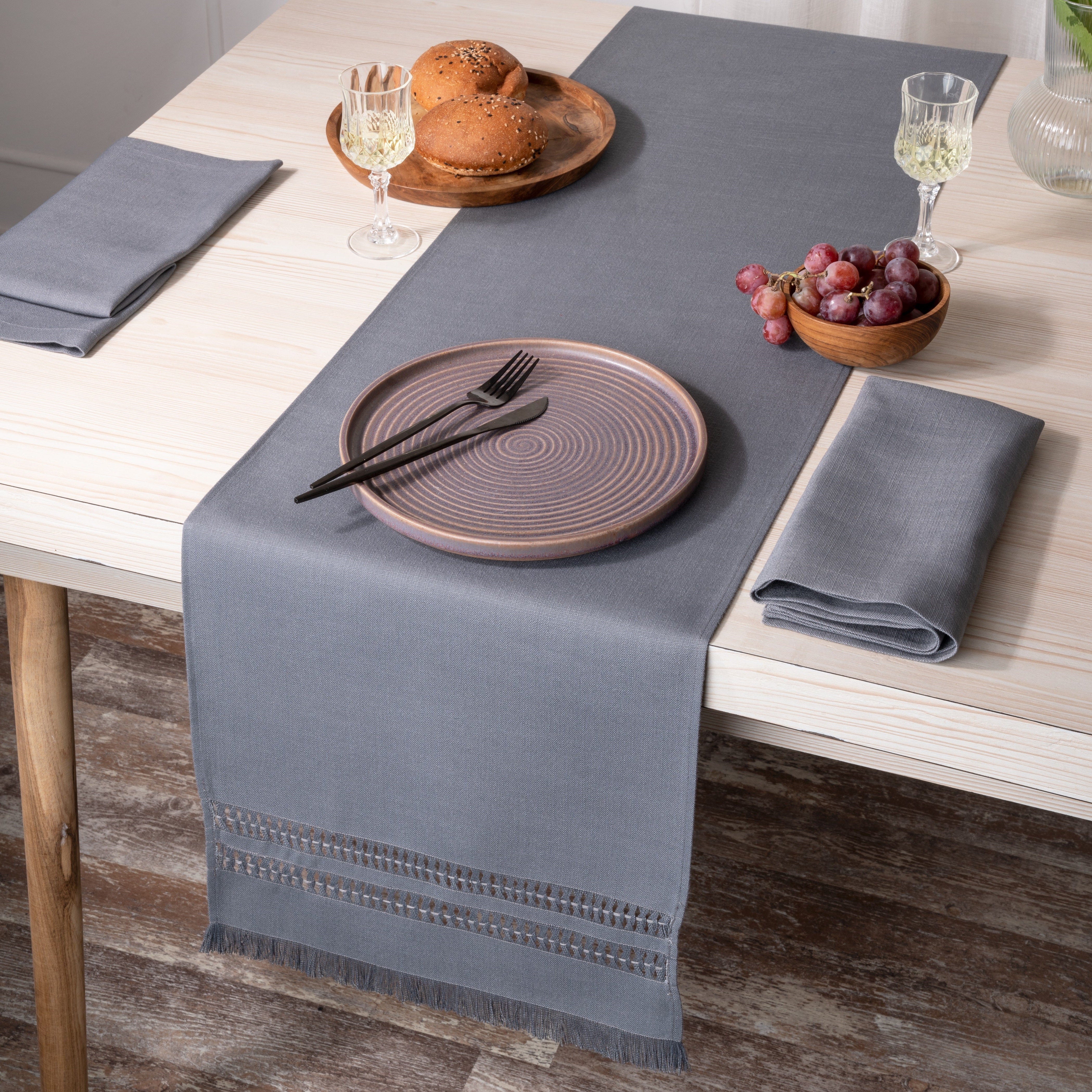 Charcoal grey faux linen table runner folded to show fabric texture