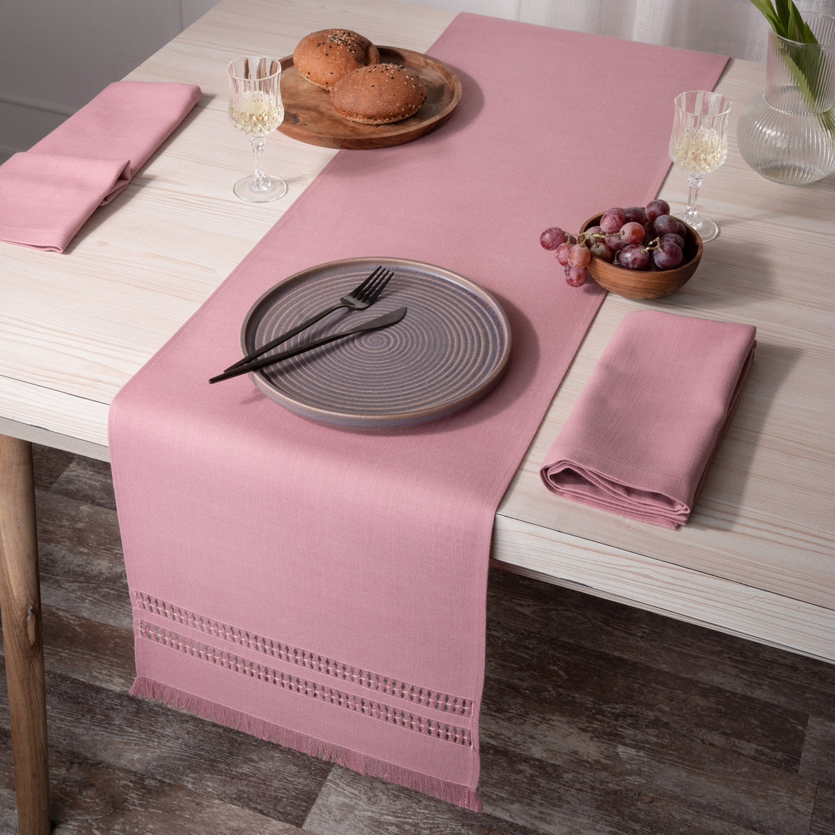 Dusty pink faux linen table runner folded to show fabric texture