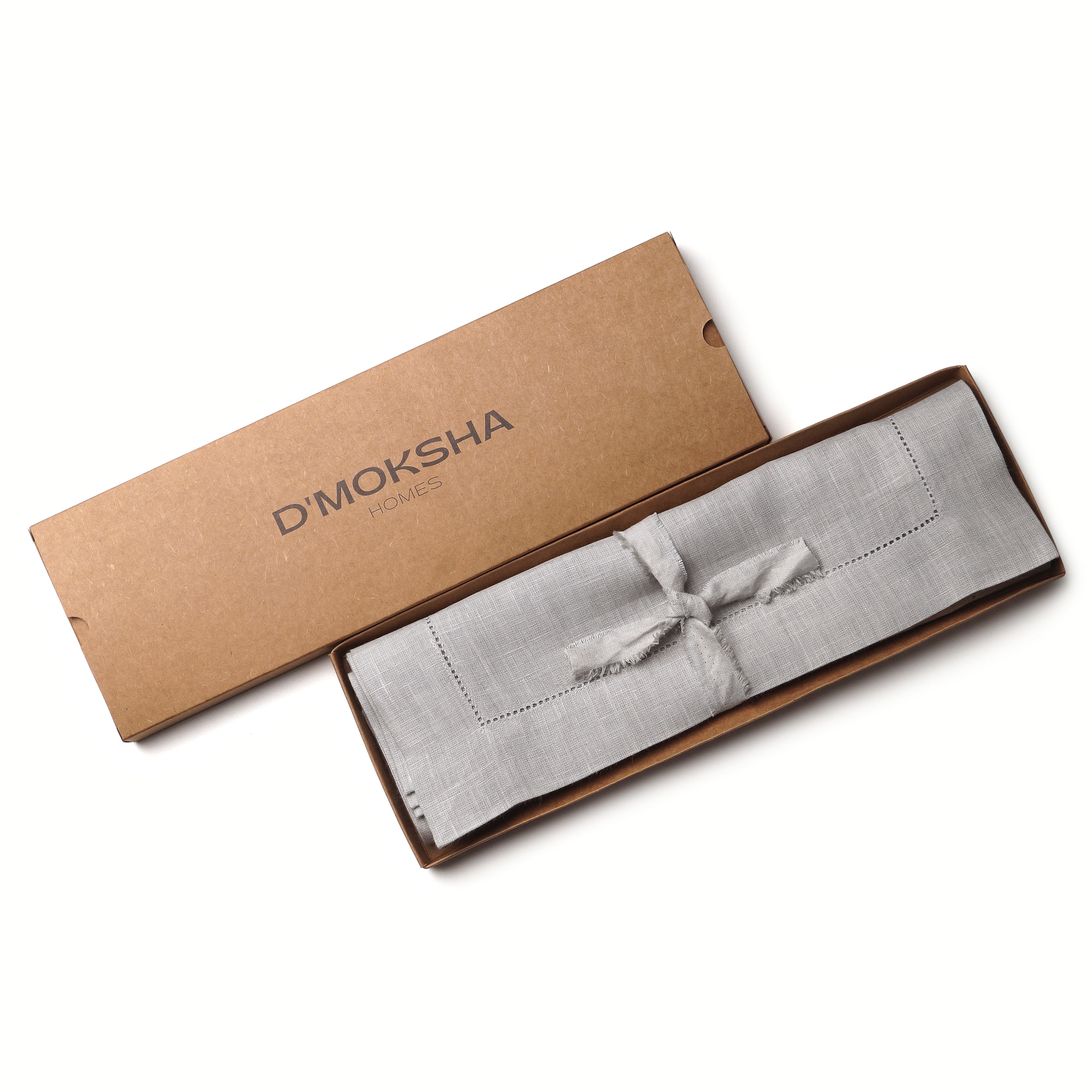 Silver grey pure linen placemats folded to show fabric texture