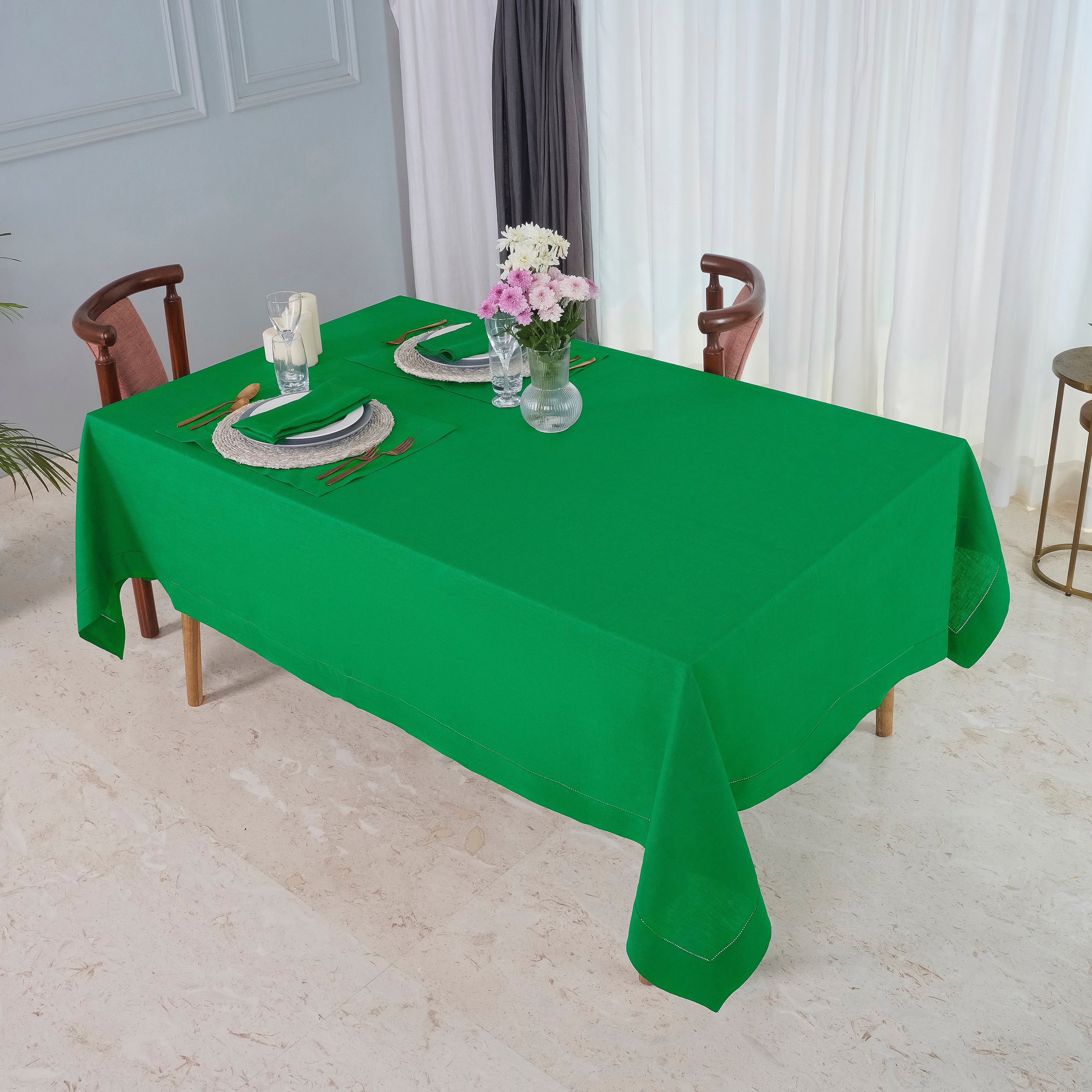 Kelly green pure linen tablecloth folded to show fabric texture
