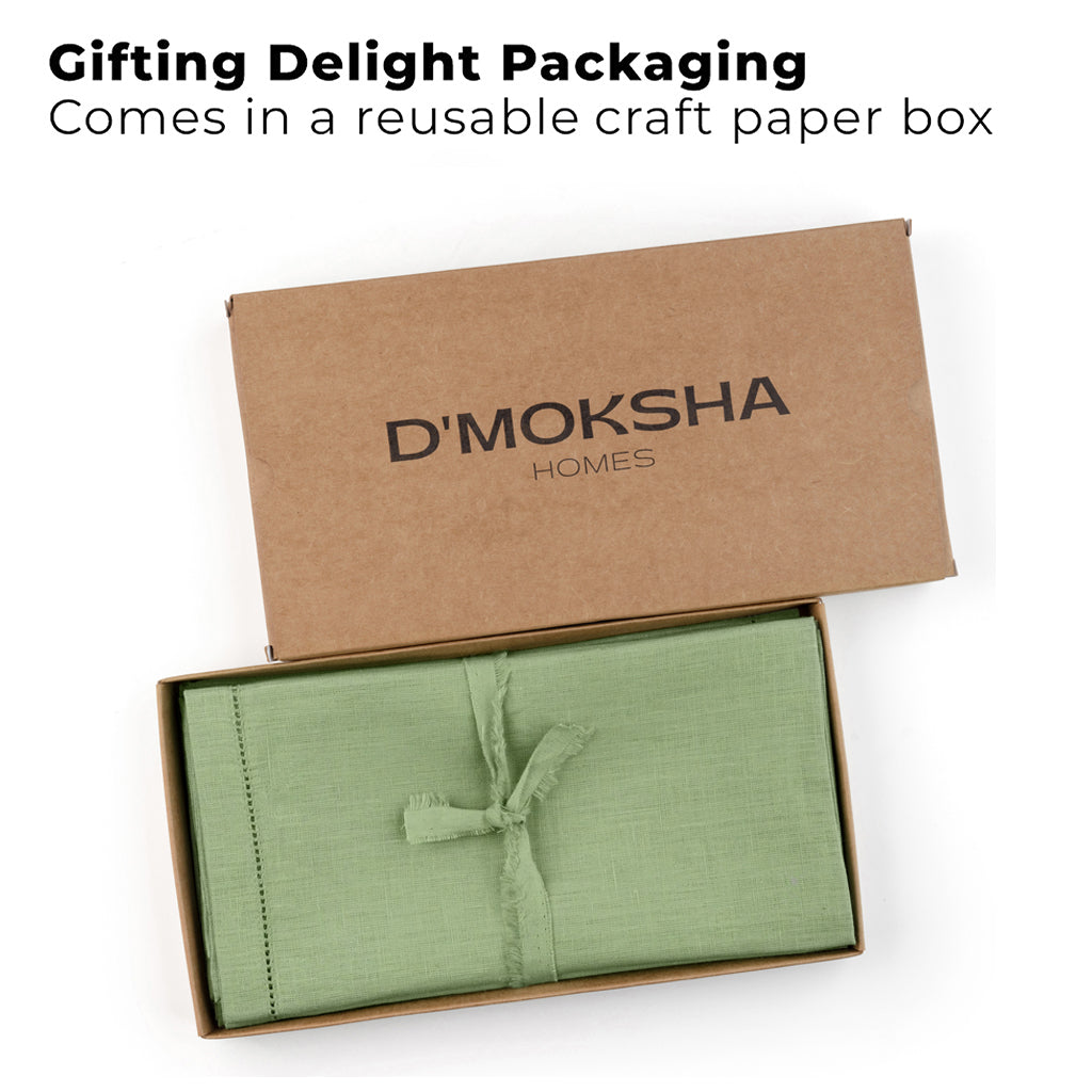 Sage green pure linen dinner napkins folded to show fabric texture