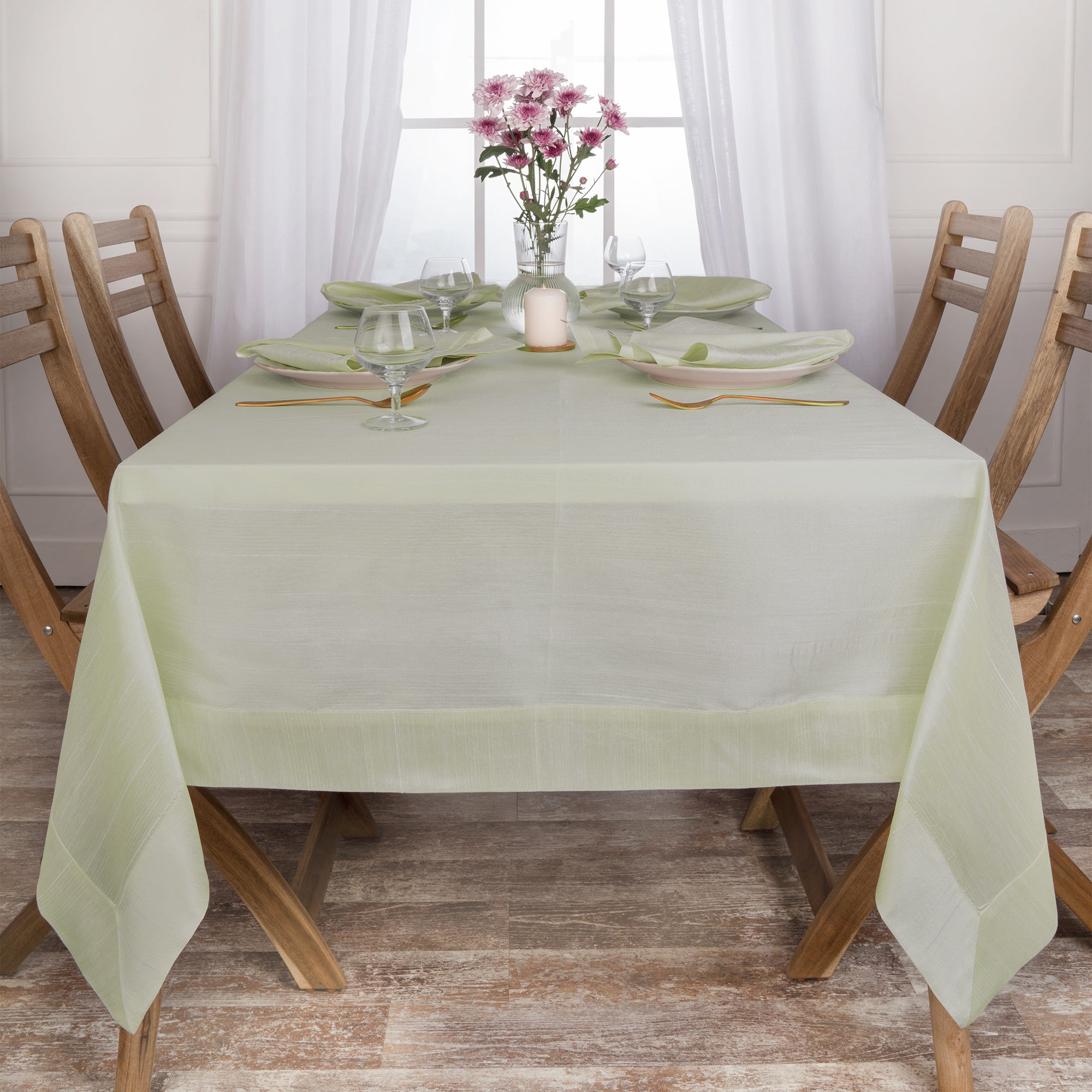 Sage green Luxe Shine tablecloth folded to show fabric texture
