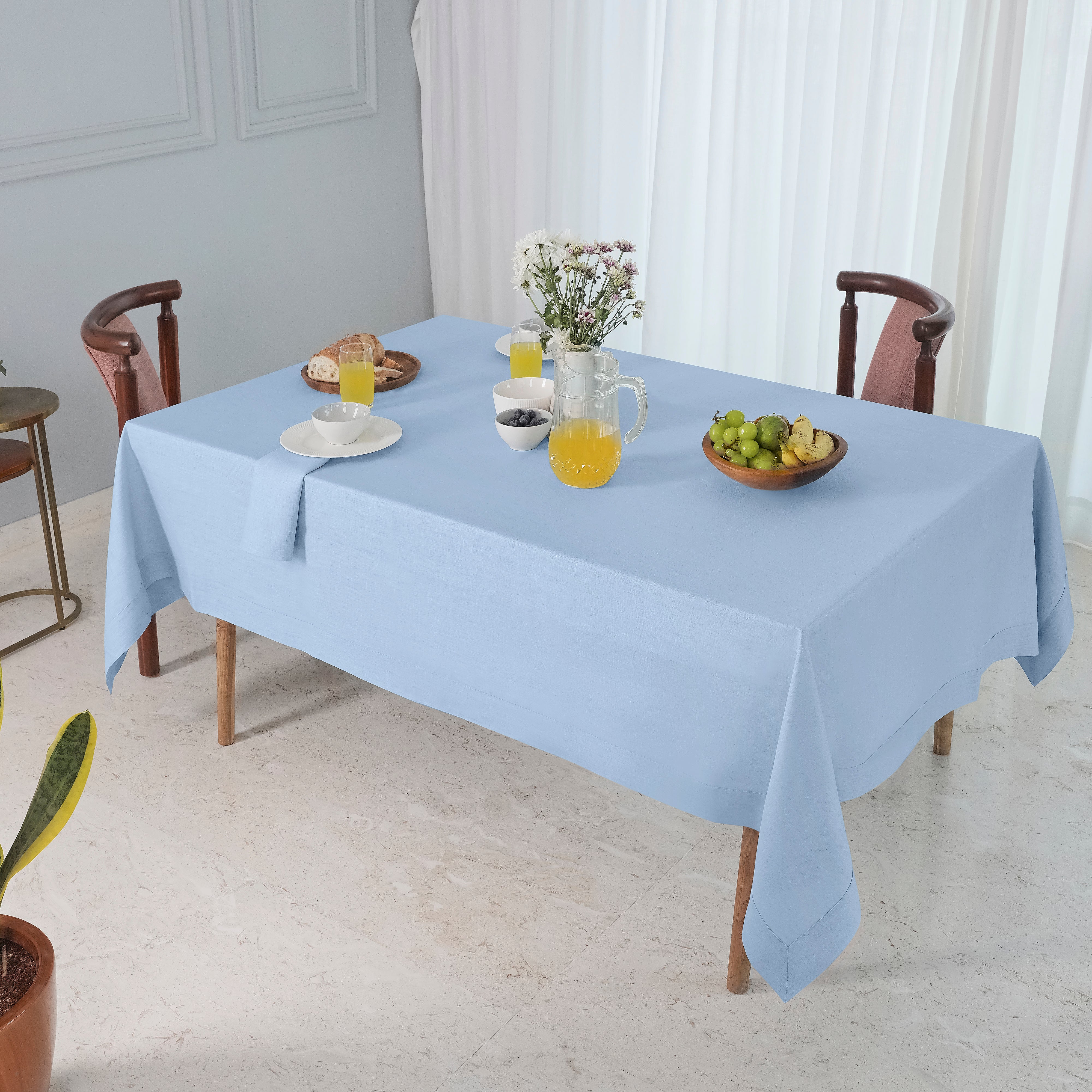 Powder blue pure linen tablecloth in a set table setting