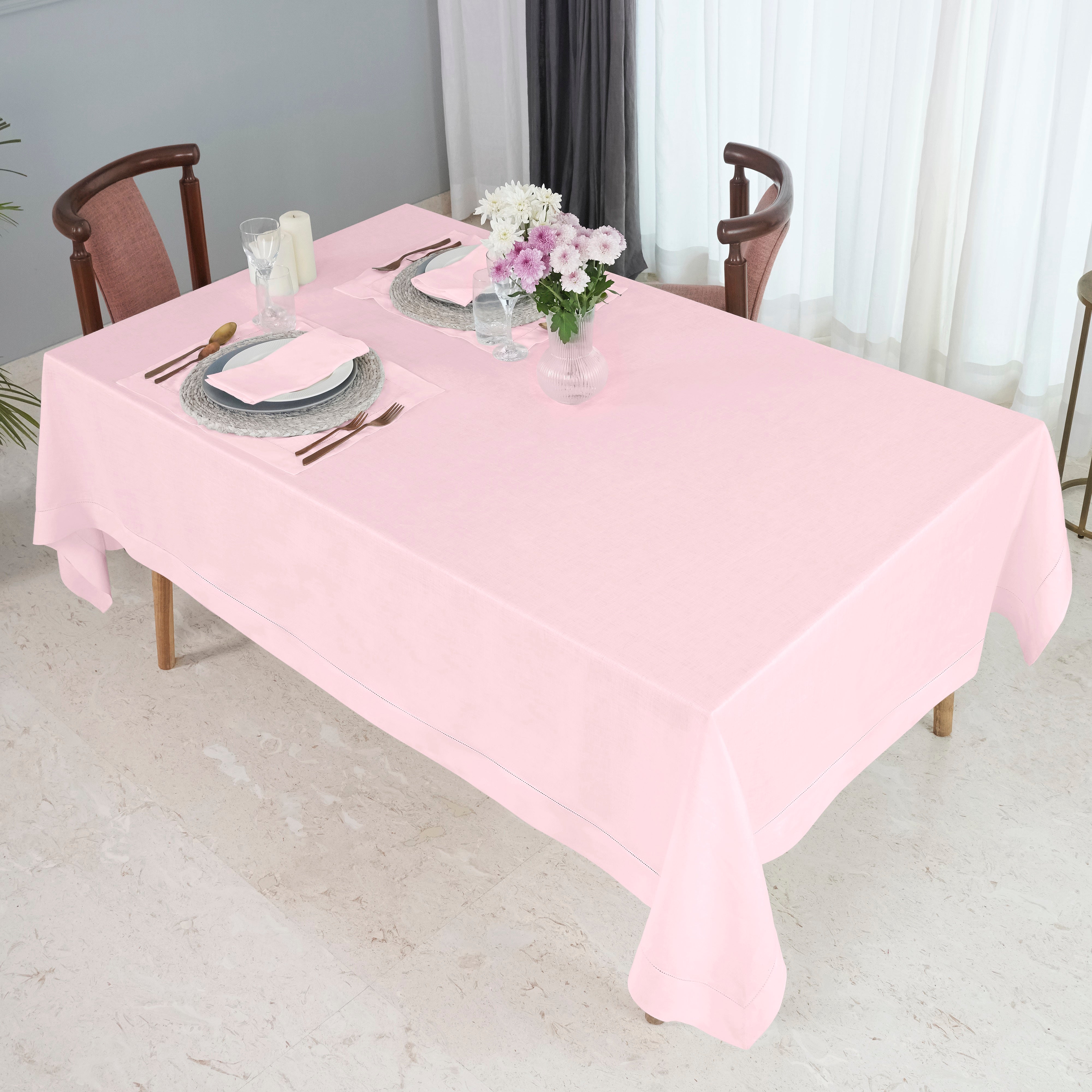 Pastel pink pure linen tablecloth in a set table setting