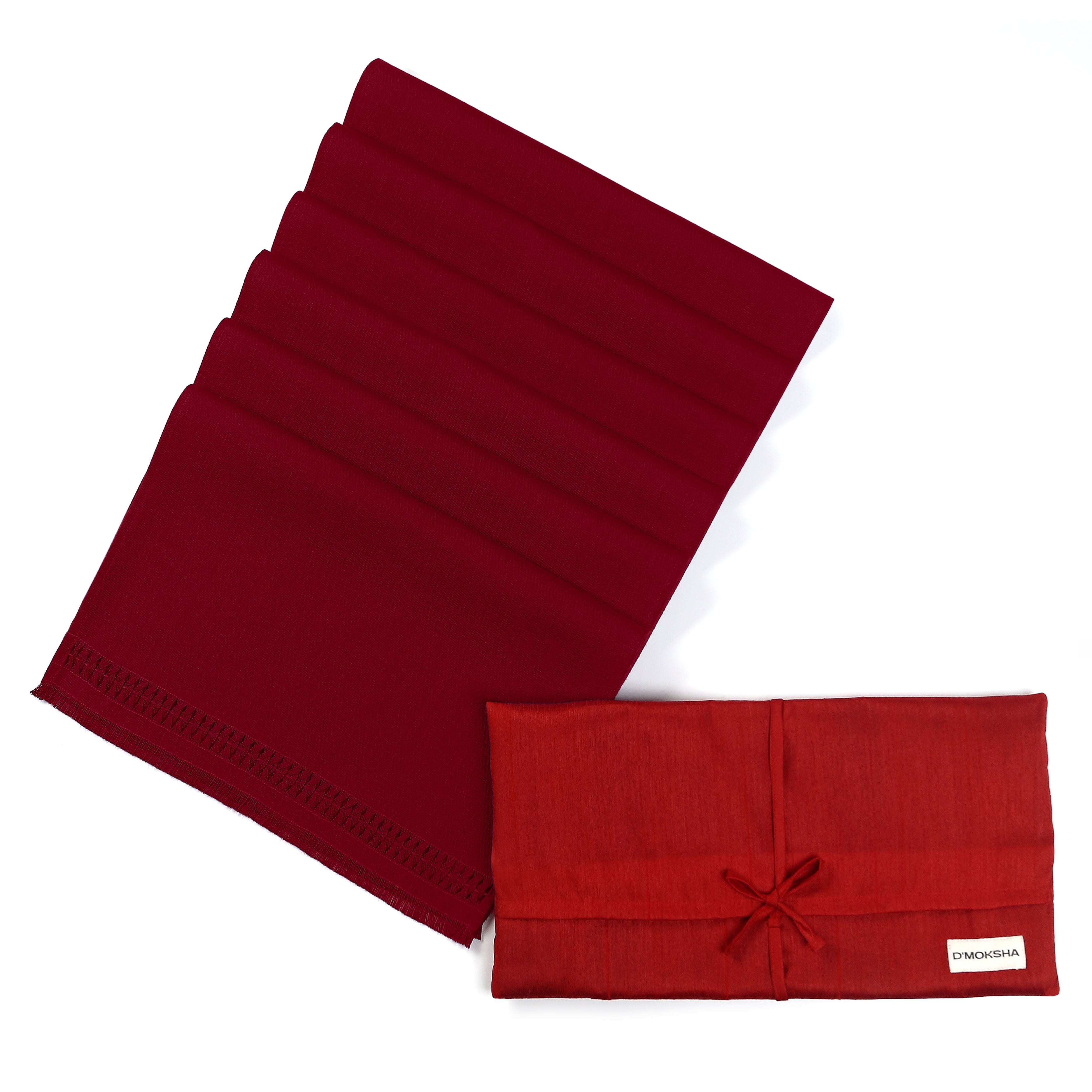 Red faux linen placemats in a set table setting