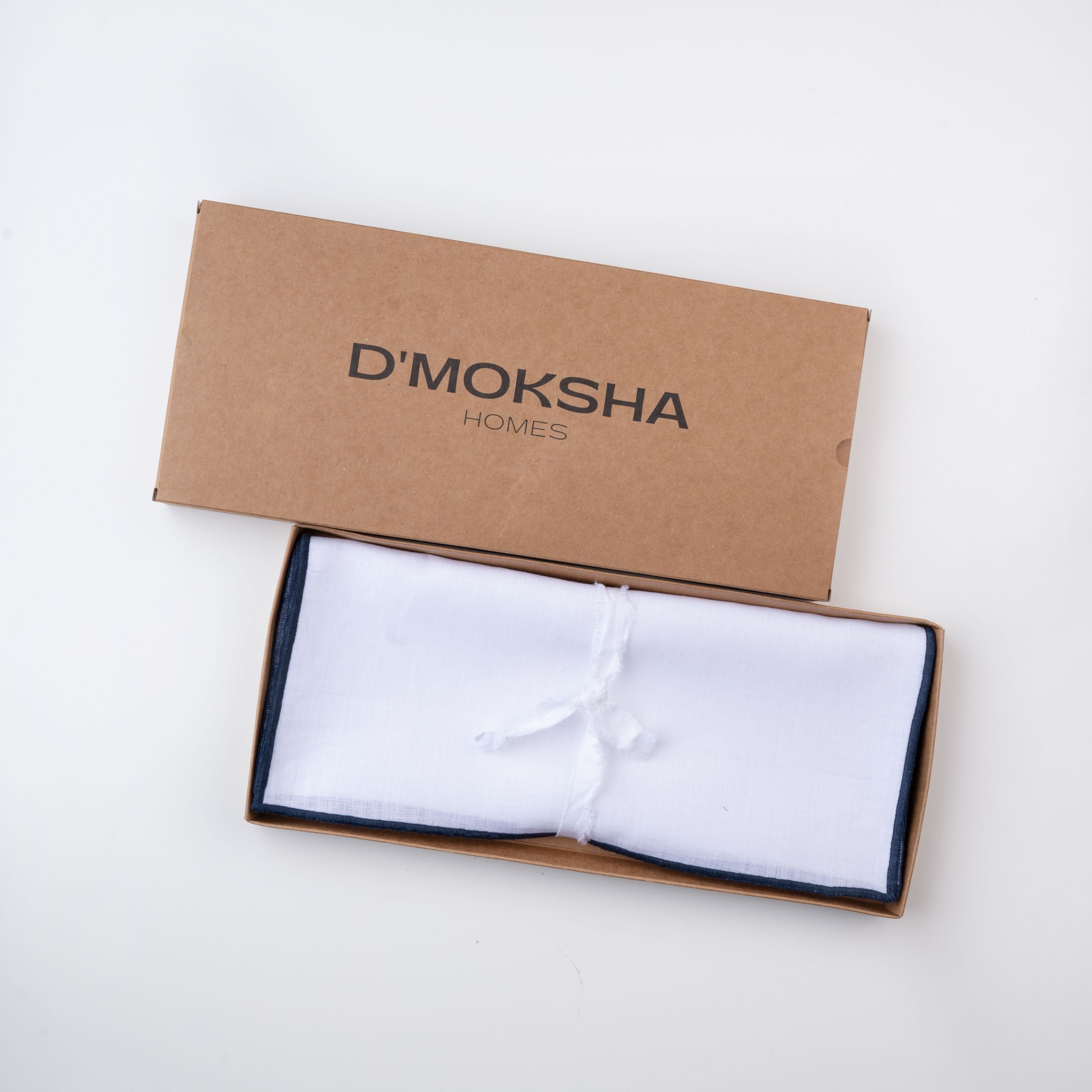 White and navy blue pure linen placemats in a set table setting
