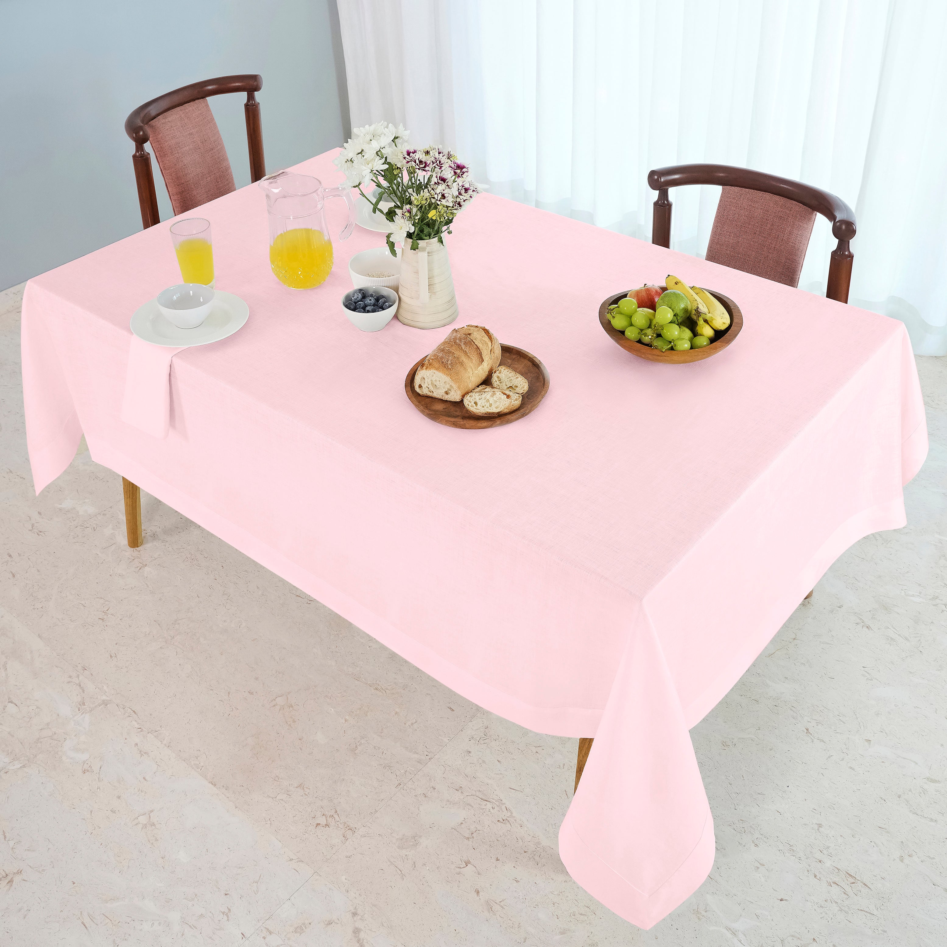 Pastel pink pure linen tablecloth in a set table setting