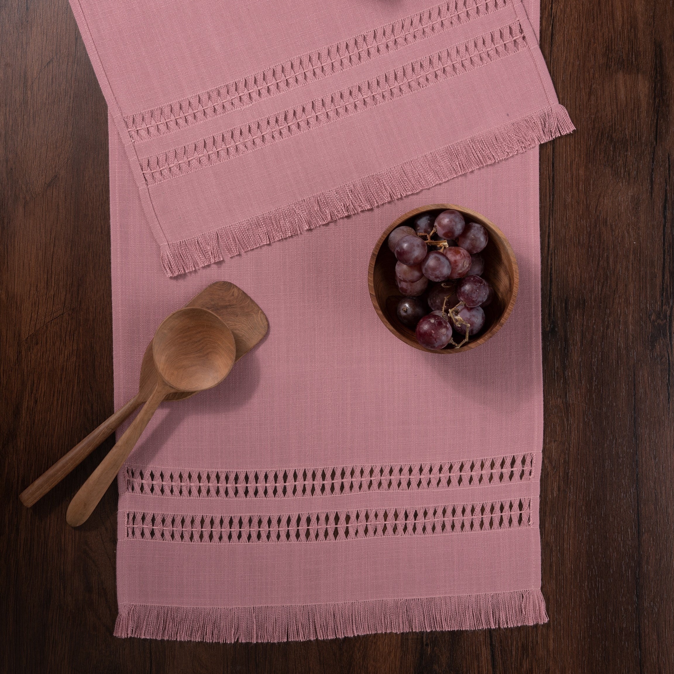 Dusty pink faux linen table runner in a set table setting